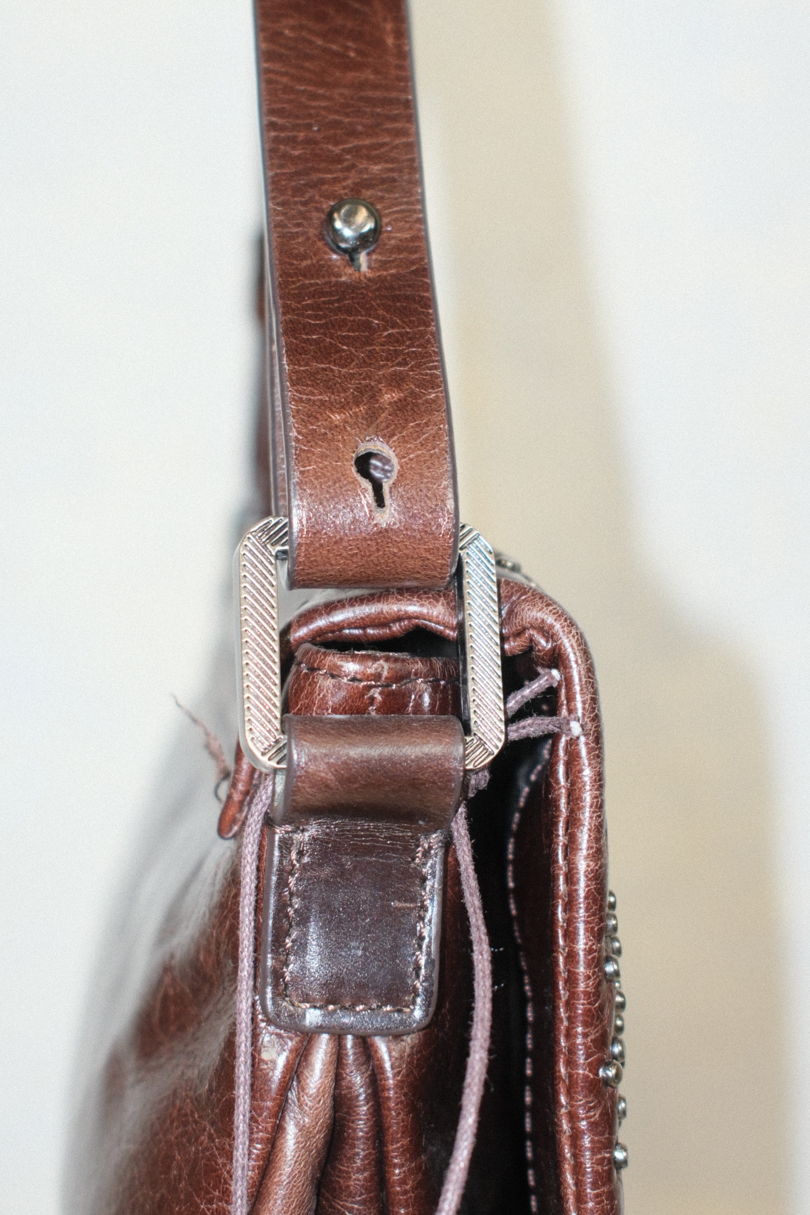 FRANCESCO BIASIA SMALL BROWN LEATHER BAG WITH FLORAL STUD DETAILS