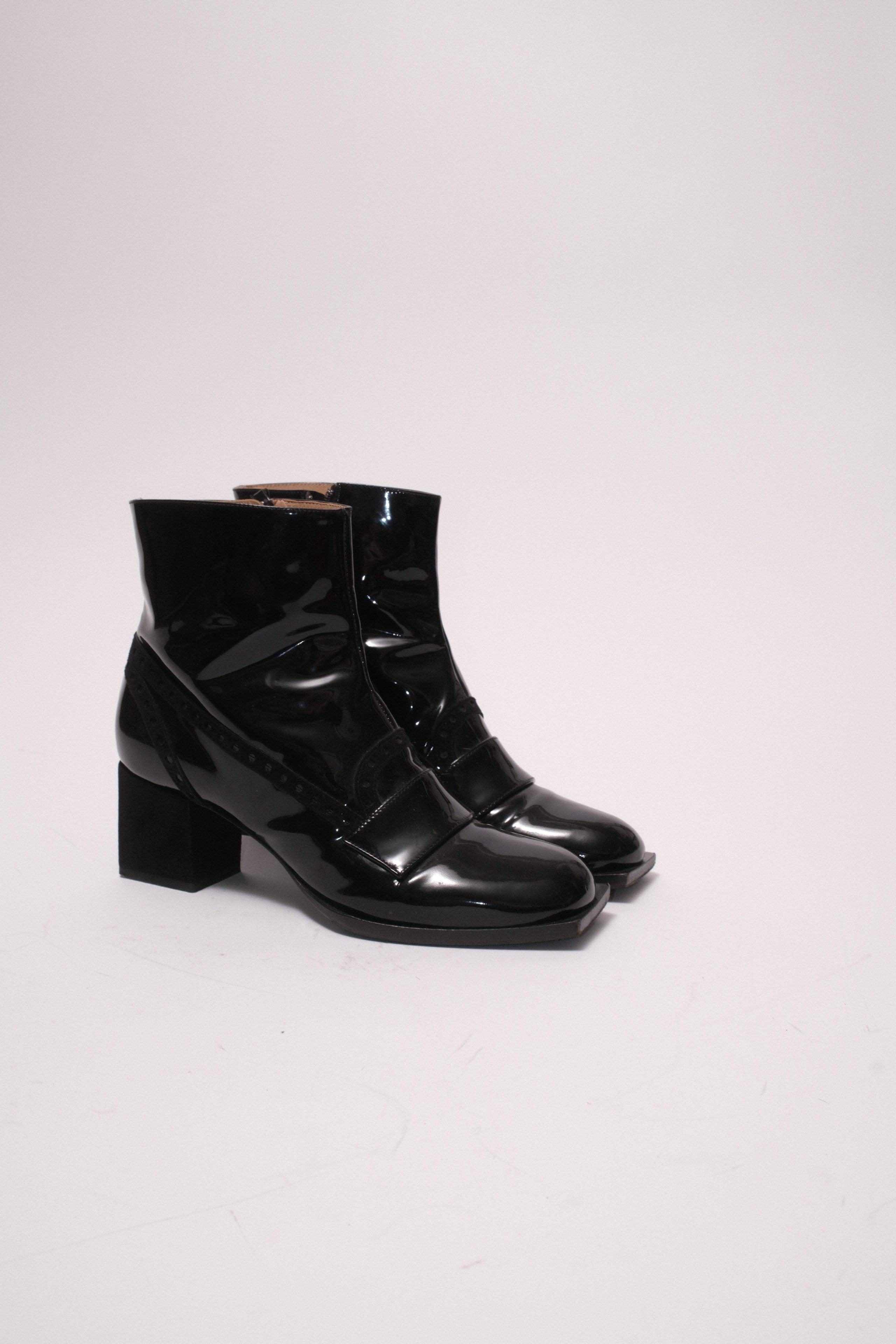Viktore and Rolf patent leather ankle boots in black