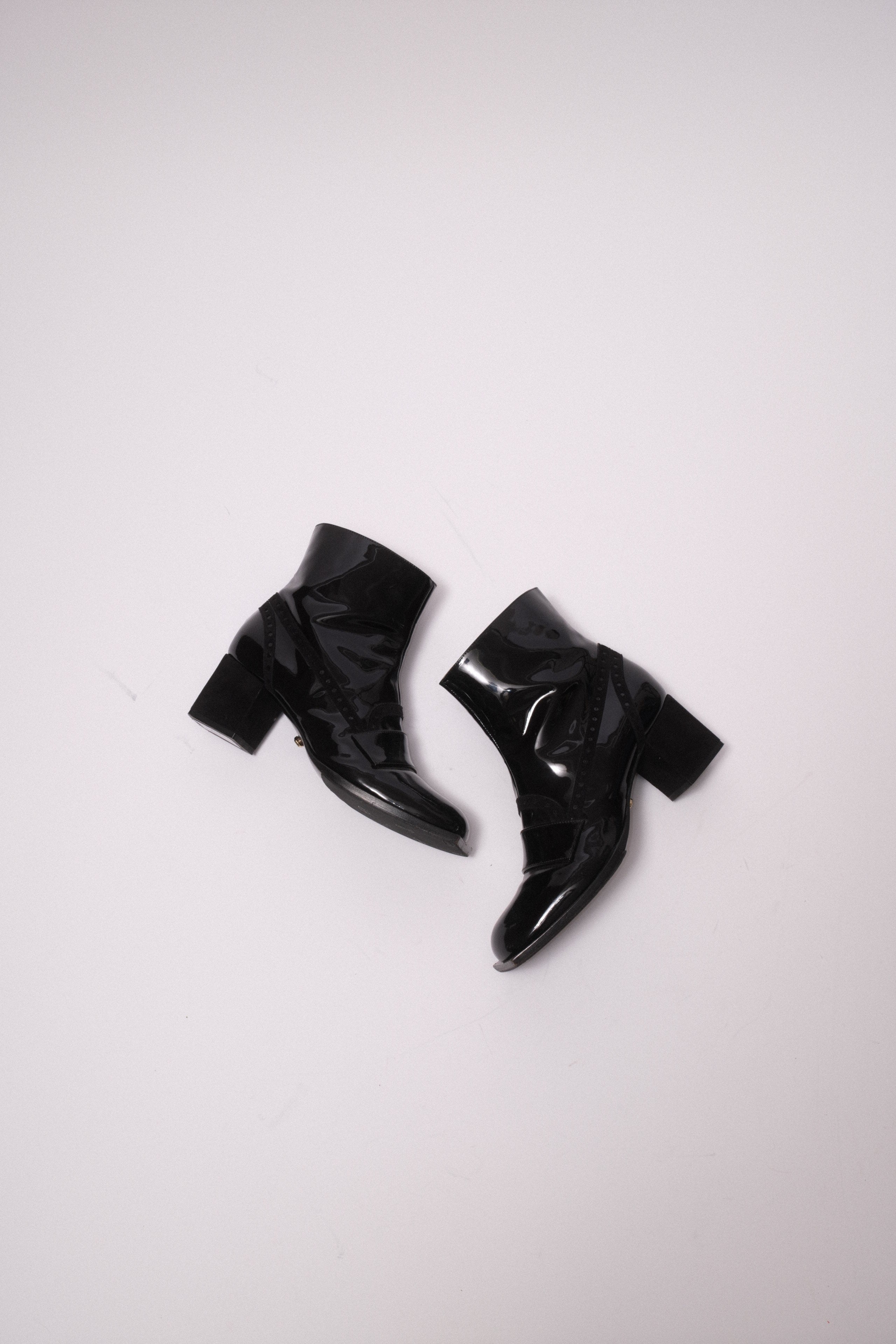 Viktore and Rolf patent leather ankle boots in black