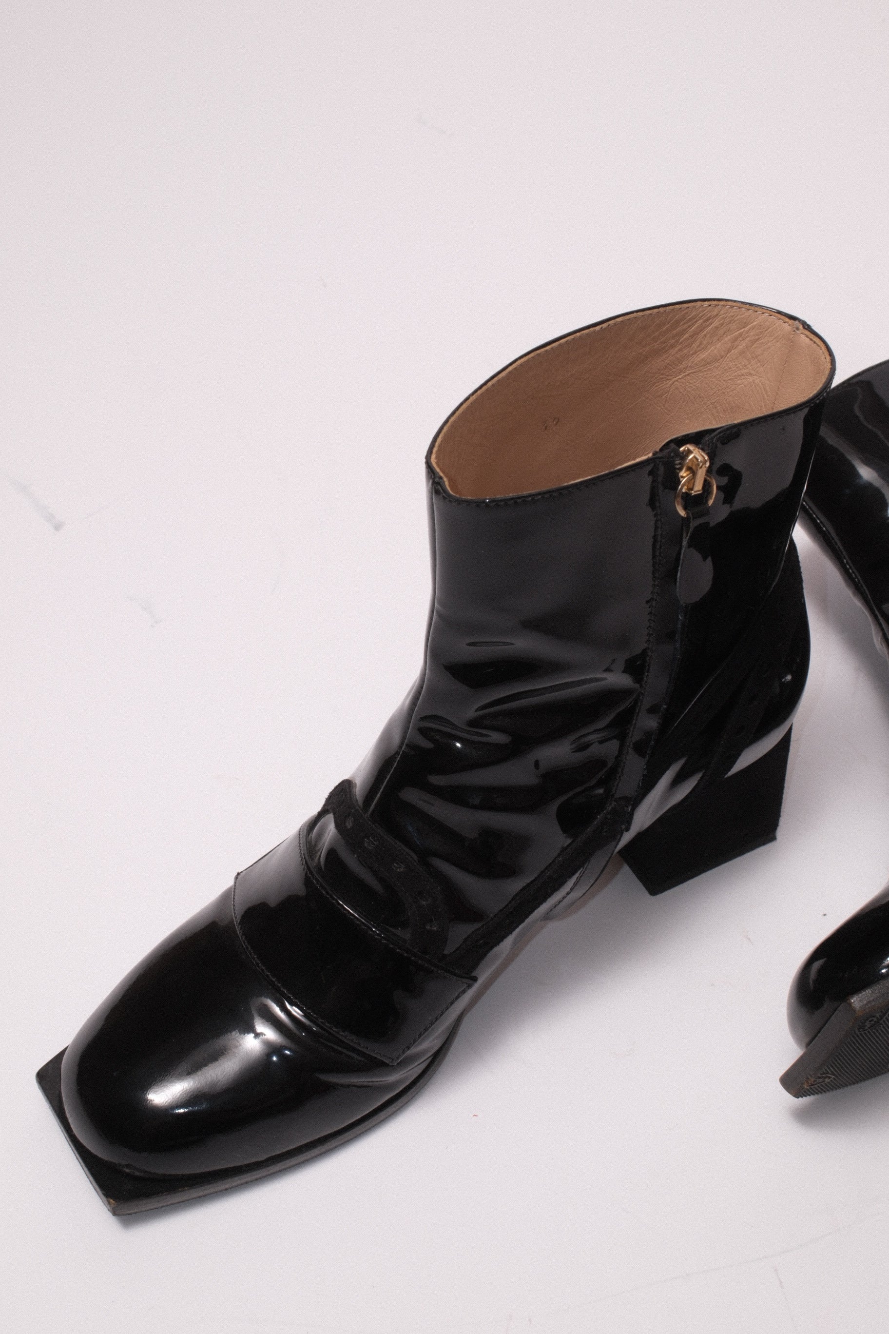 Viktore and Rolf patent leather ankle boots in black