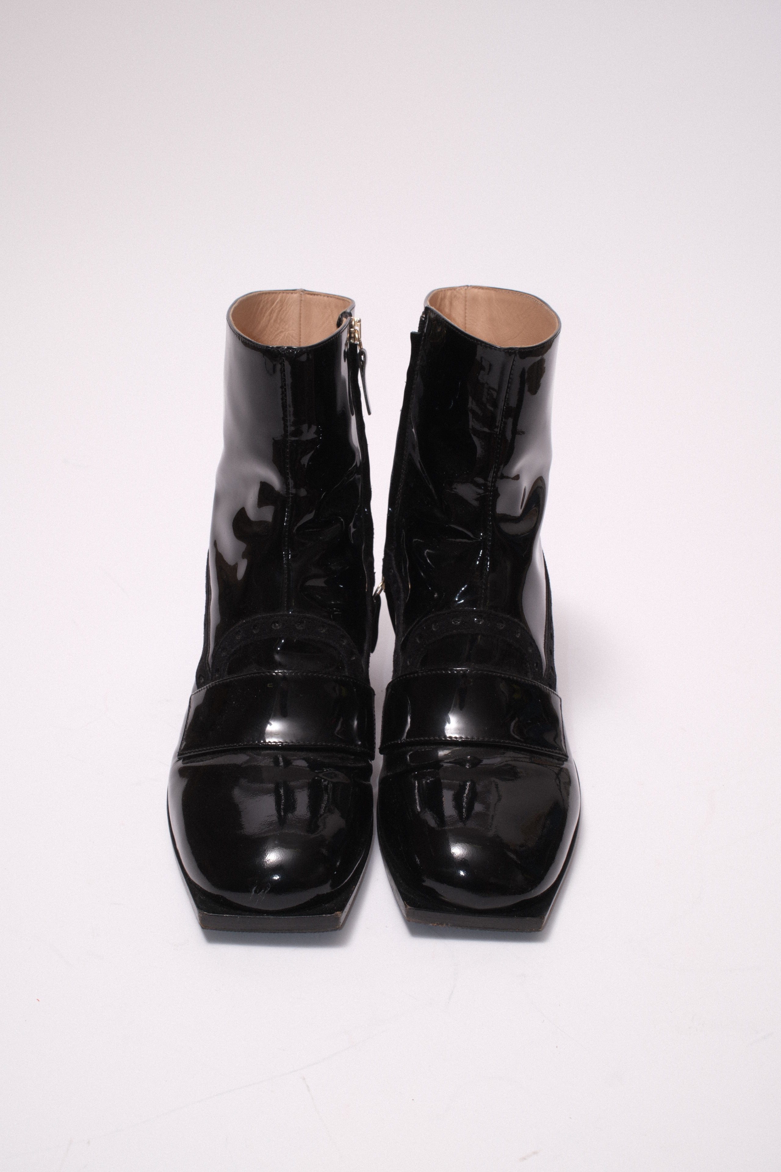 Viktore and Rolf patent leather ankle boots in black