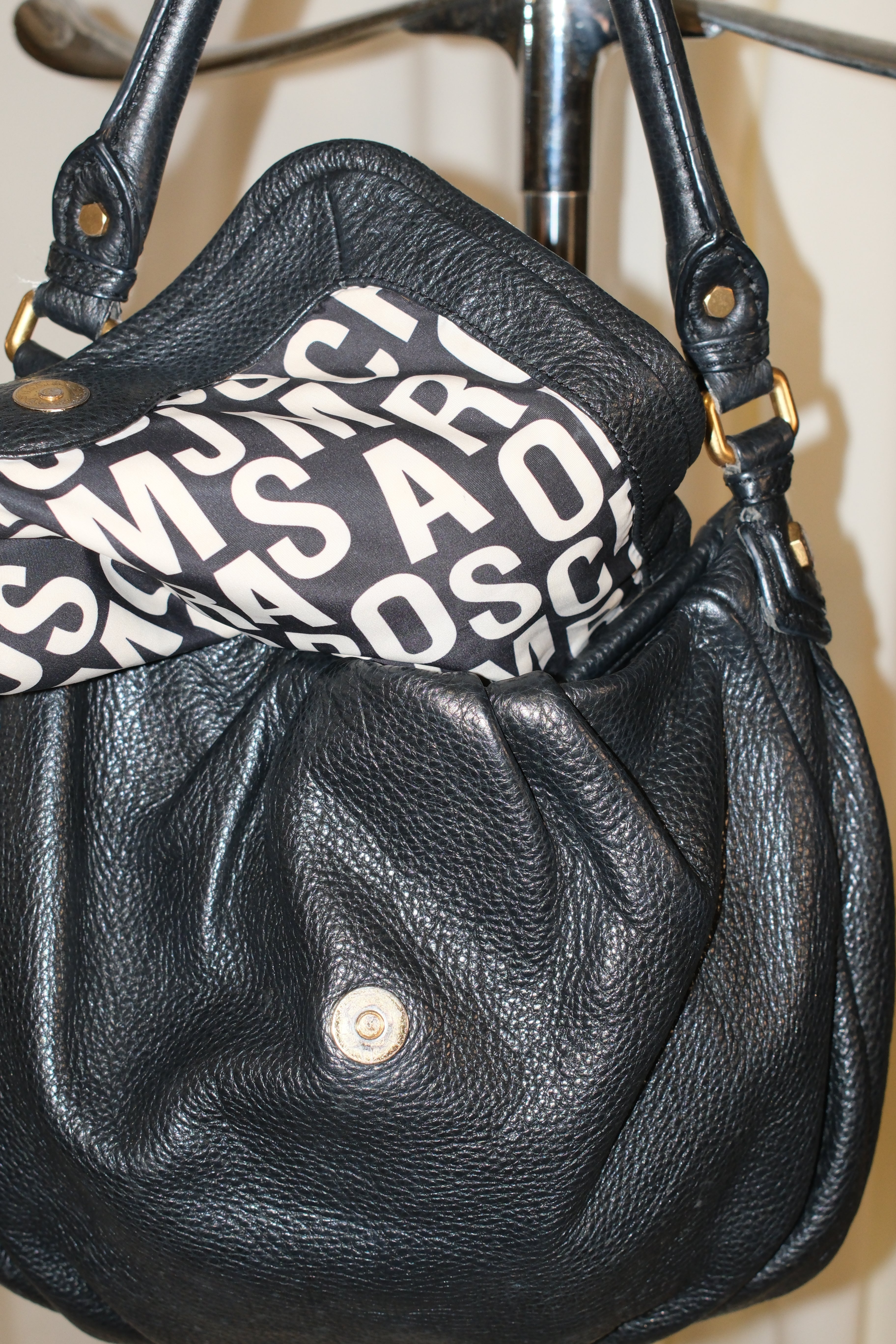 Marc Jacobs black shoulder bag with magnetic snap closure