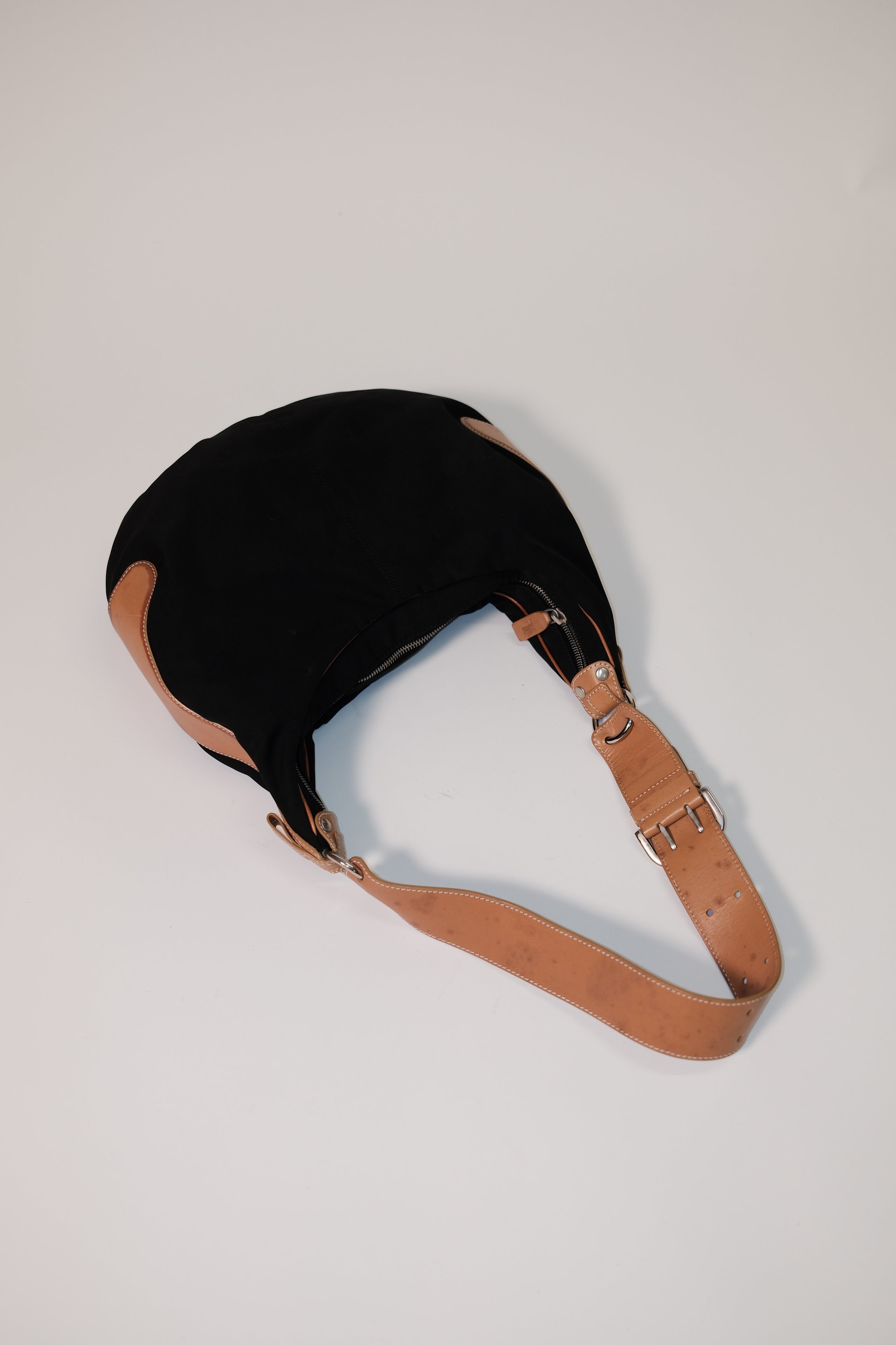 Tod's long strap cross body bag in black canvas and tan leather