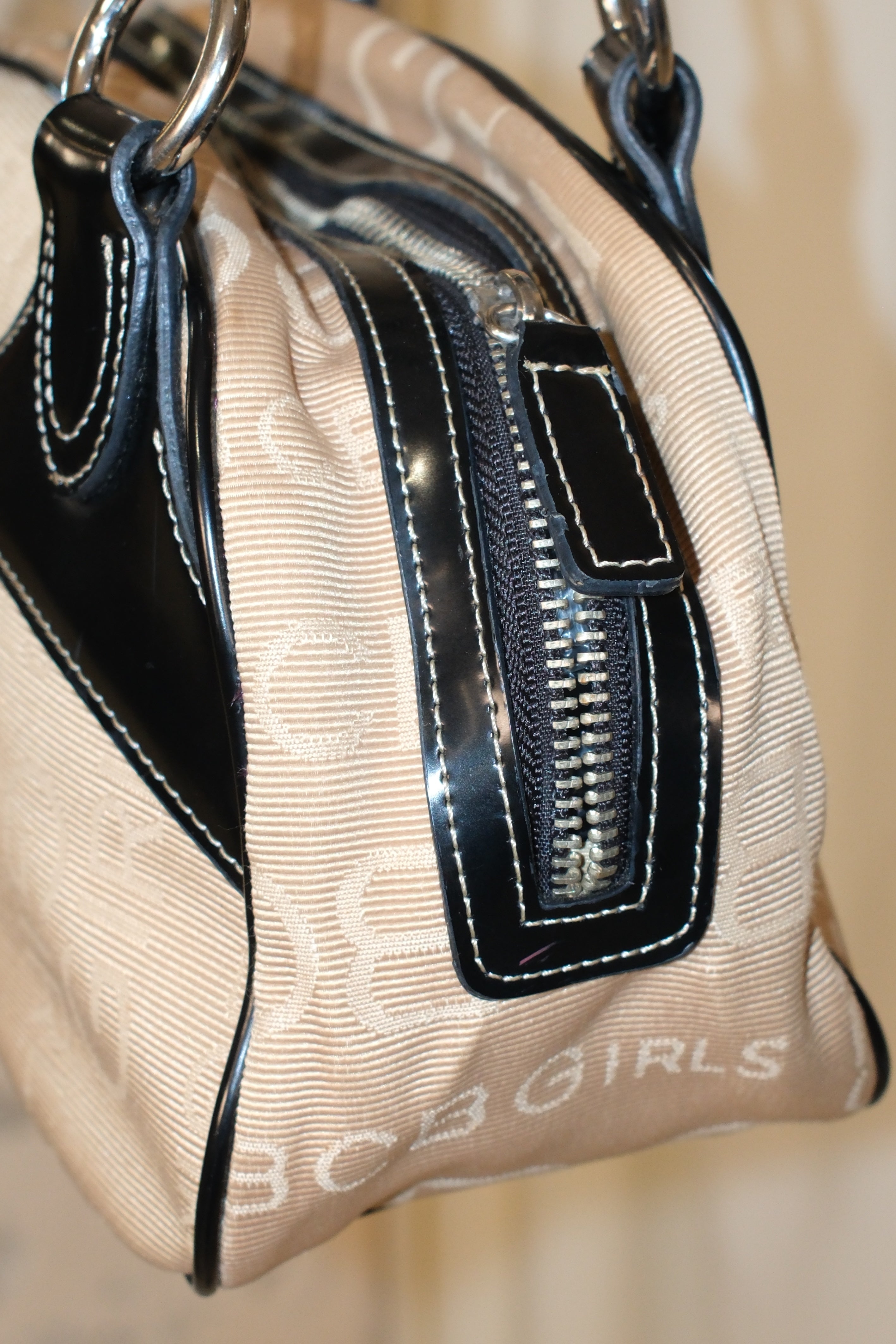 BCBG MAXIMIZER MONOGRAM CANVAS BOWLING BAG