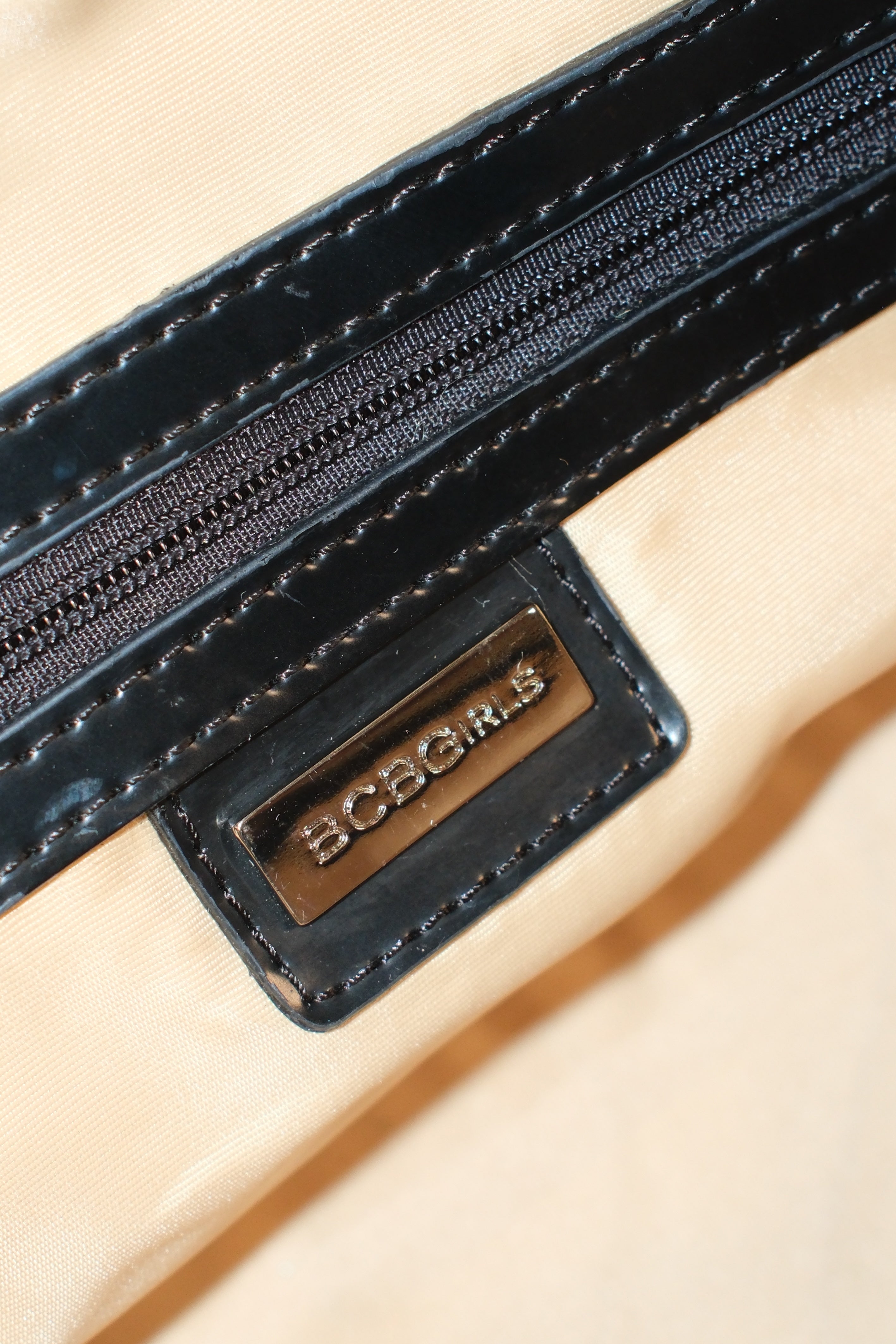 BCBG MAXIMIZER MONOGRAM CANVAS BOWLING BAG