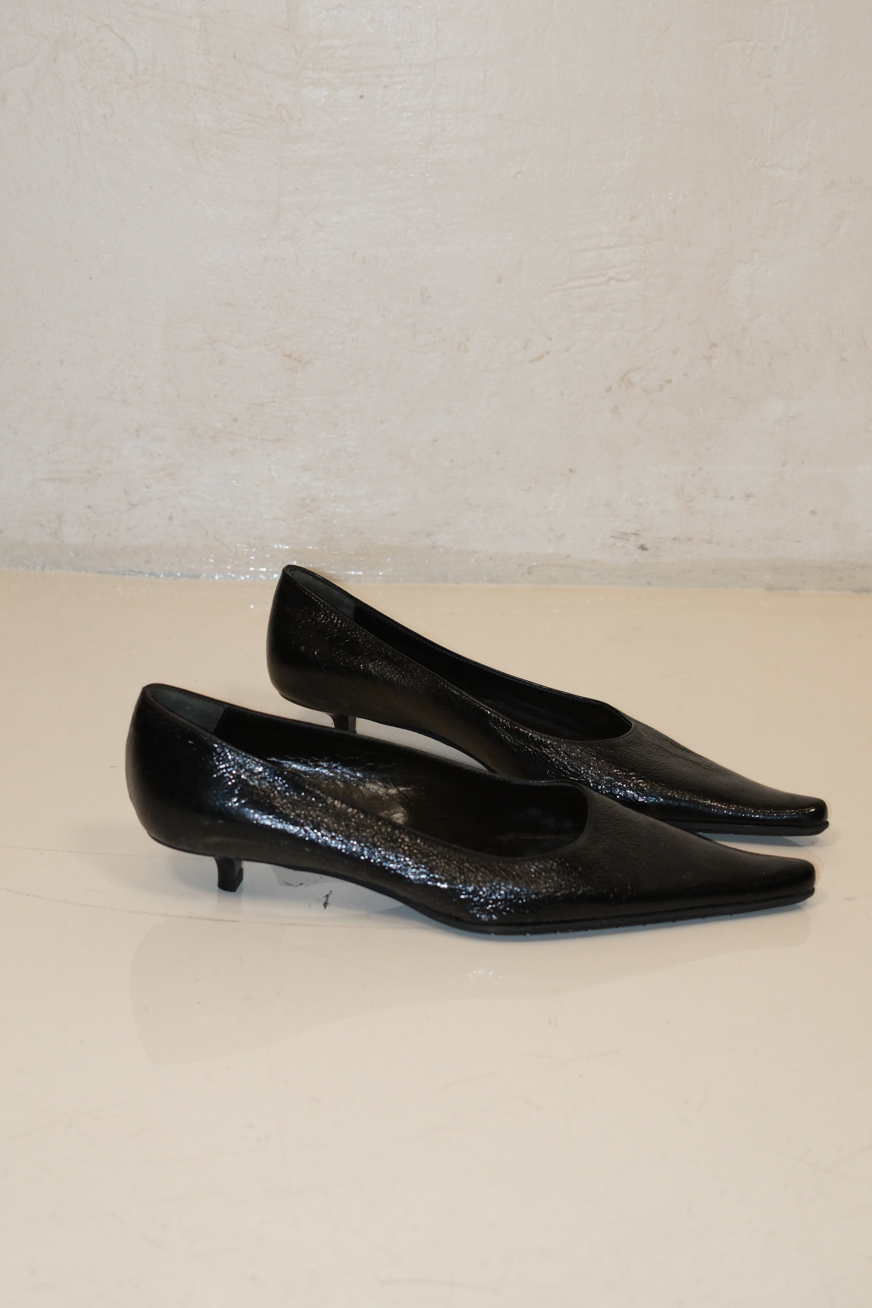 Italian pointed toe kitten heels in black patent leather
