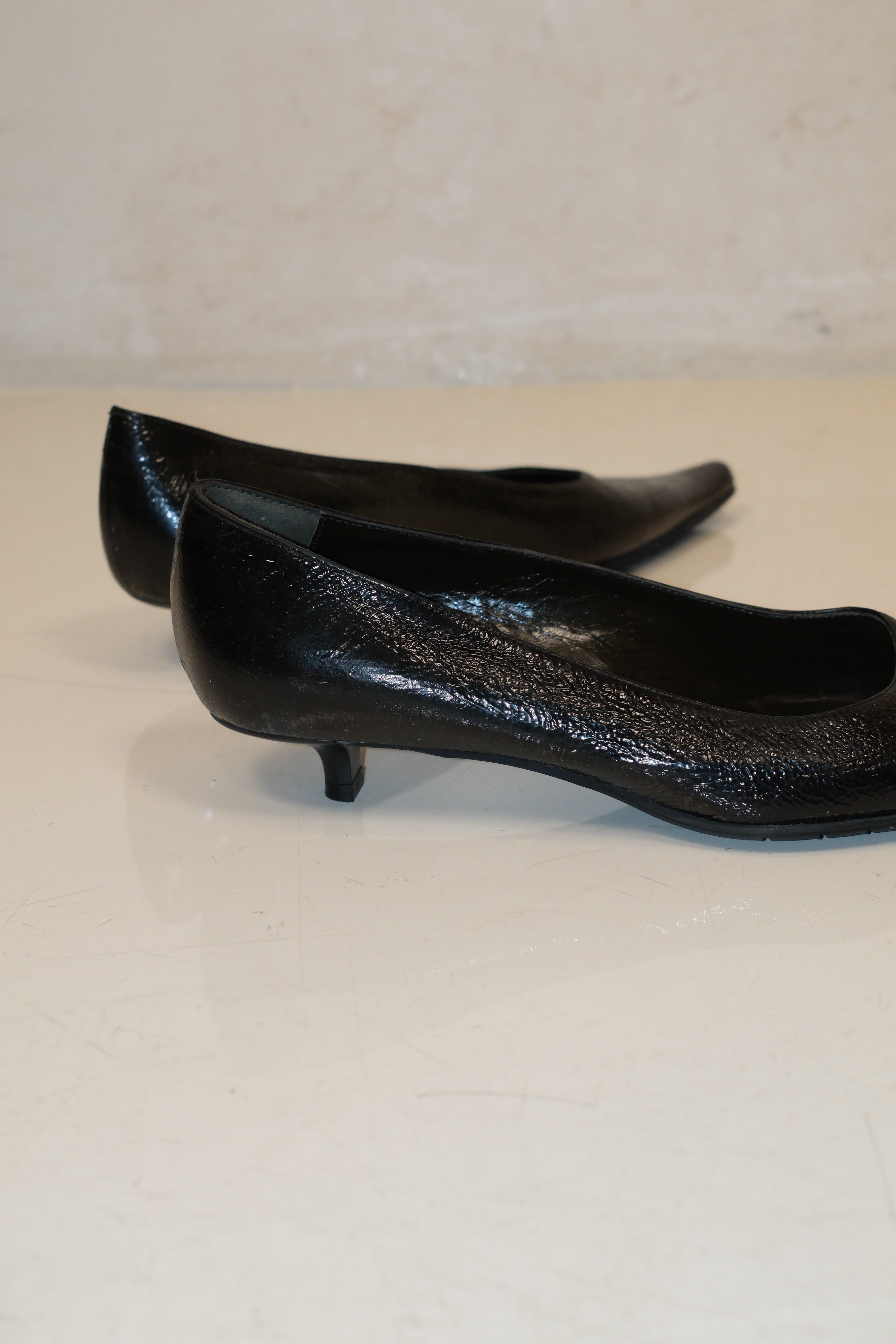 Italian pointed toe kitten heels in black patent leather