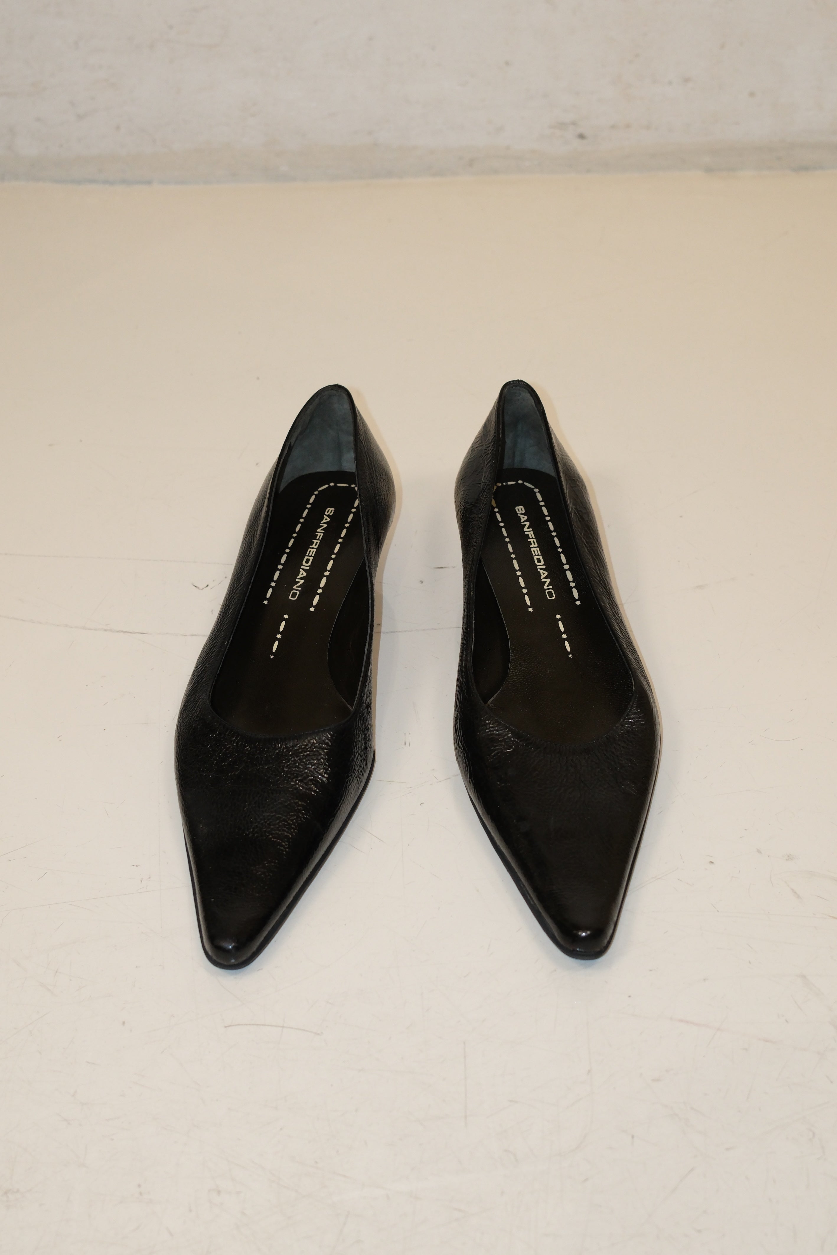 Italian pointed toe kitten heels in black patent leather