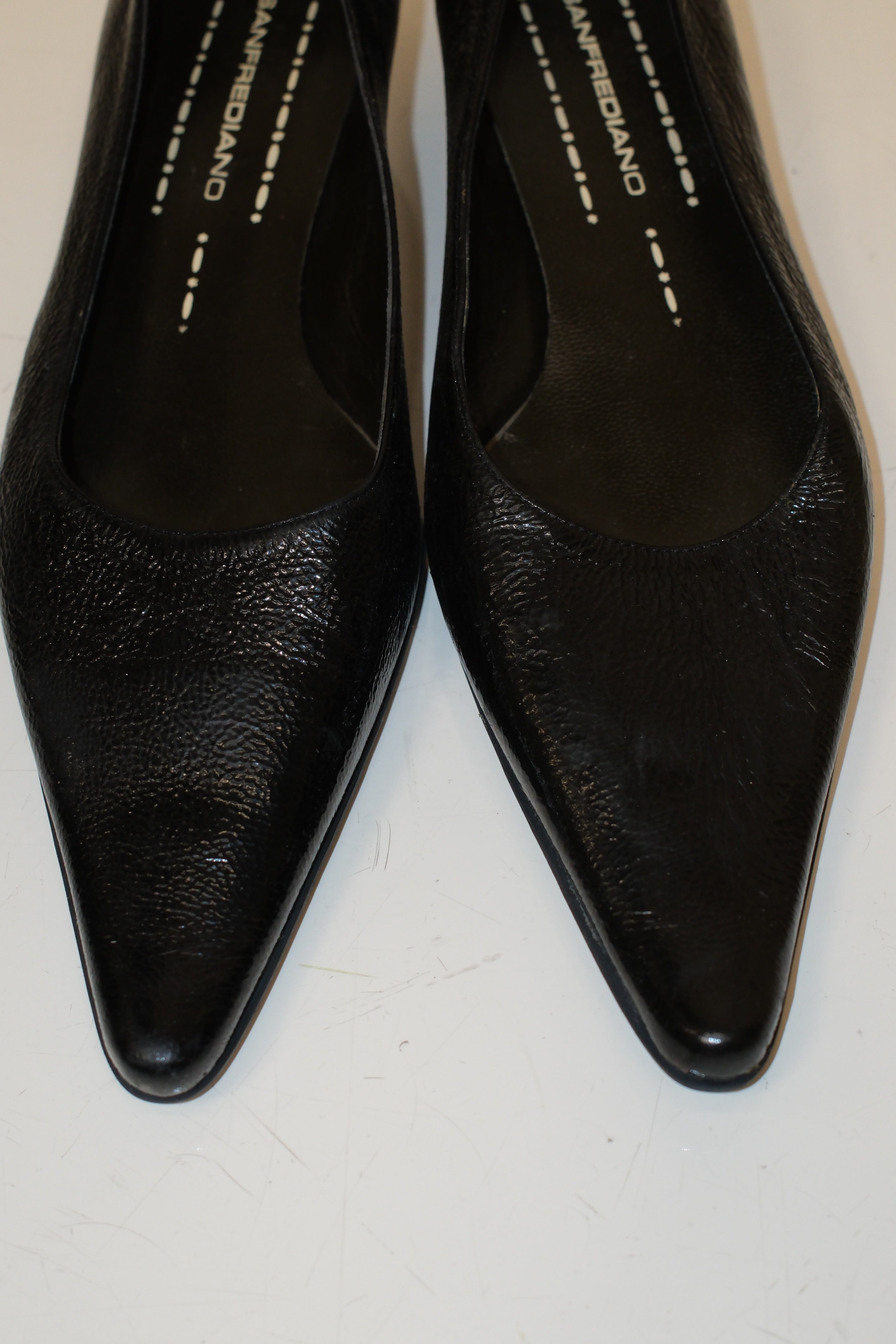 Italian pointed toe kitten heels in black patent leather