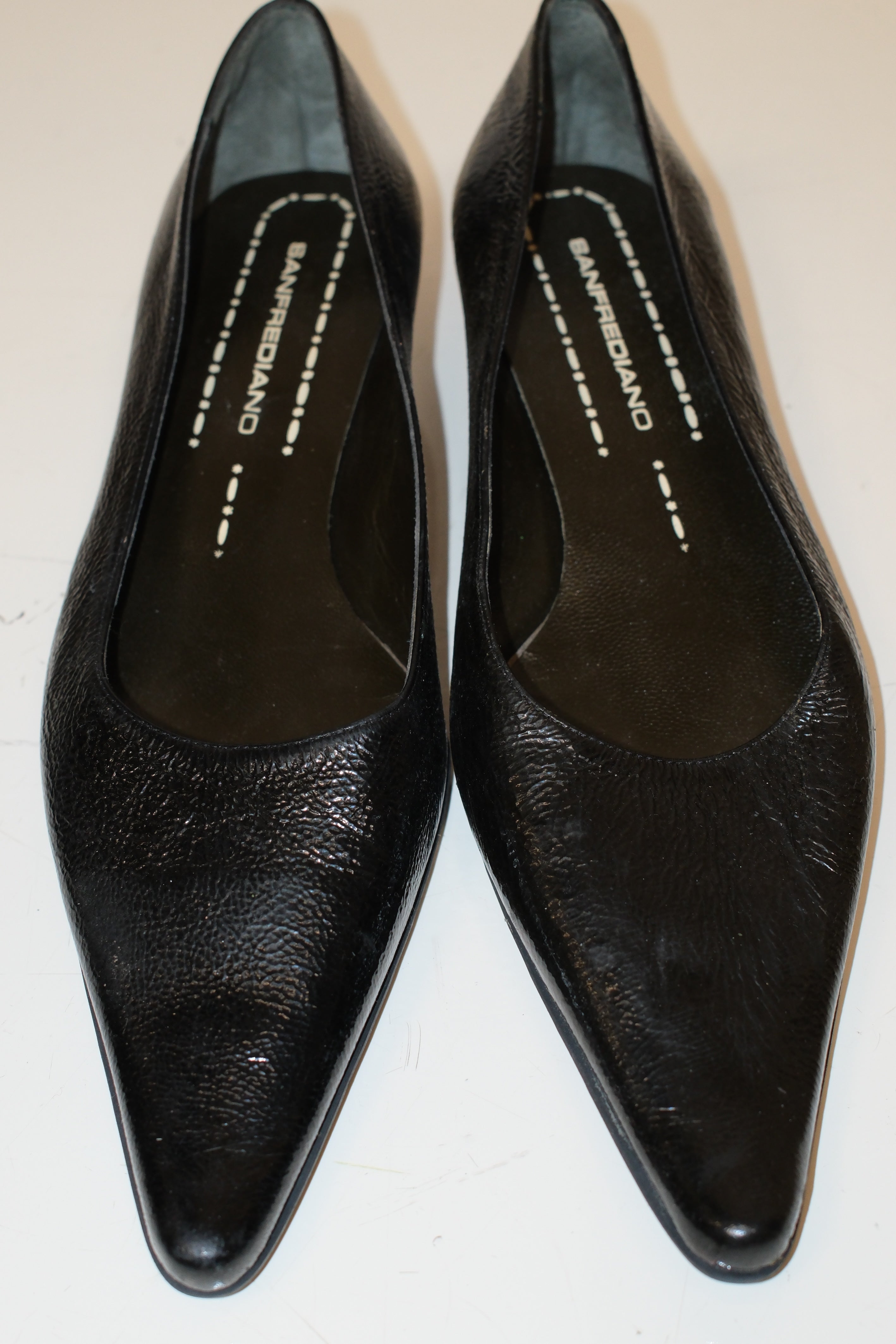 Italian pointed toe kitten heels in black patent leather