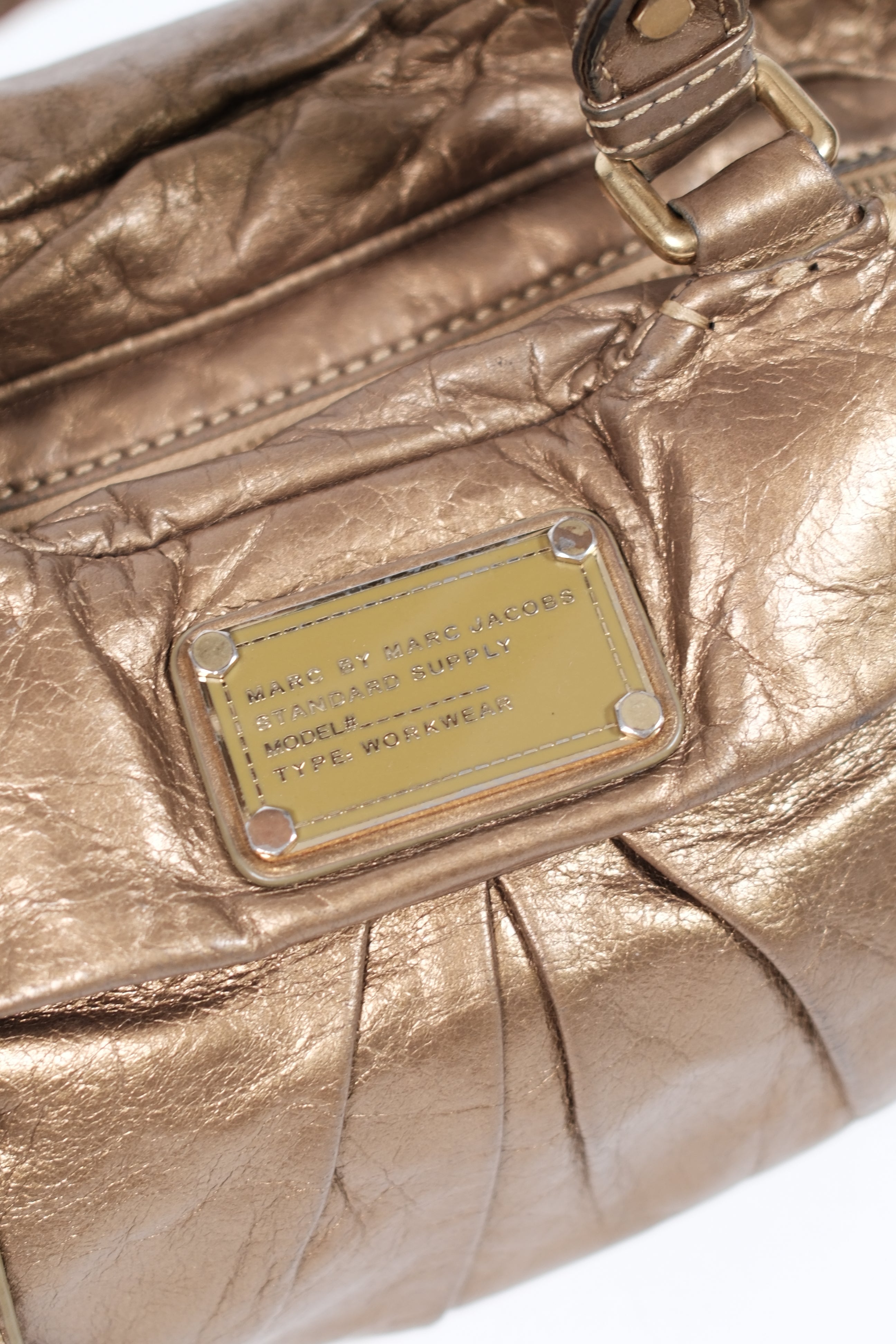 Marc jacobs gold metallic handbag with twisted handles