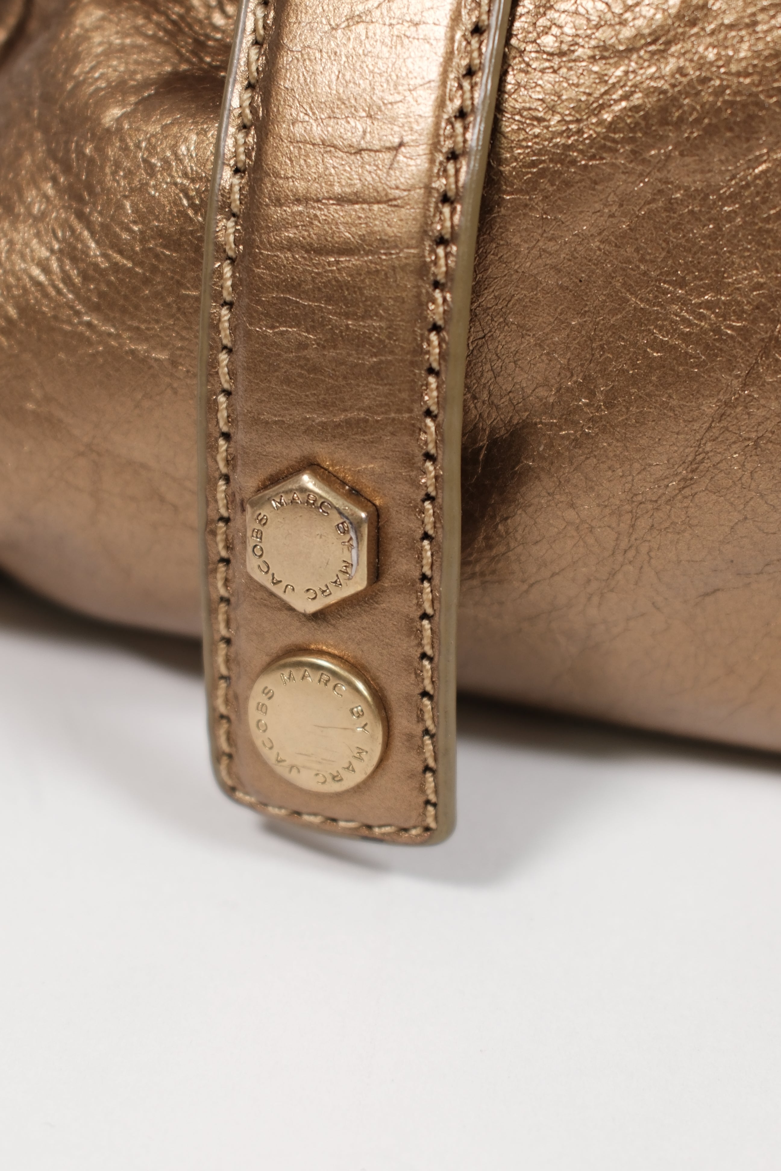 Marc jacobs gold metallic handbag with twisted handles