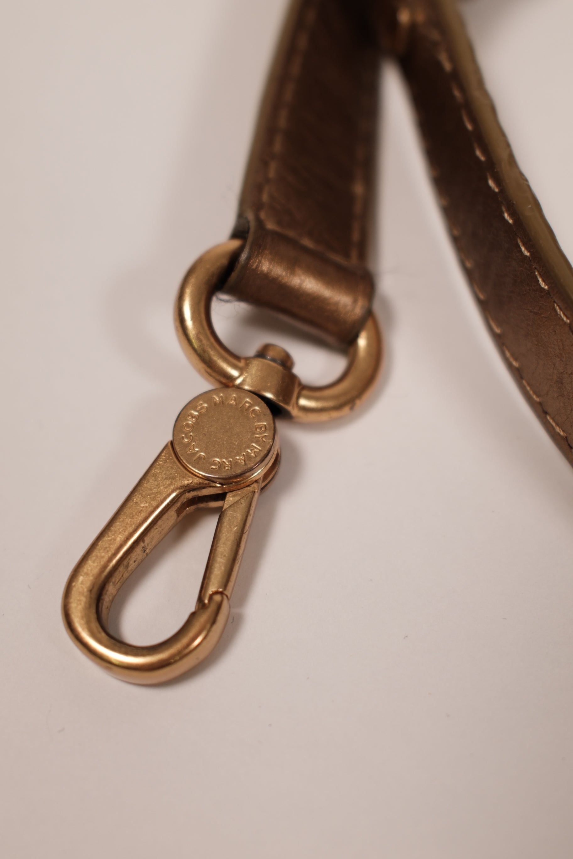 Marc jacobs gold metallic handbag with twisted handles