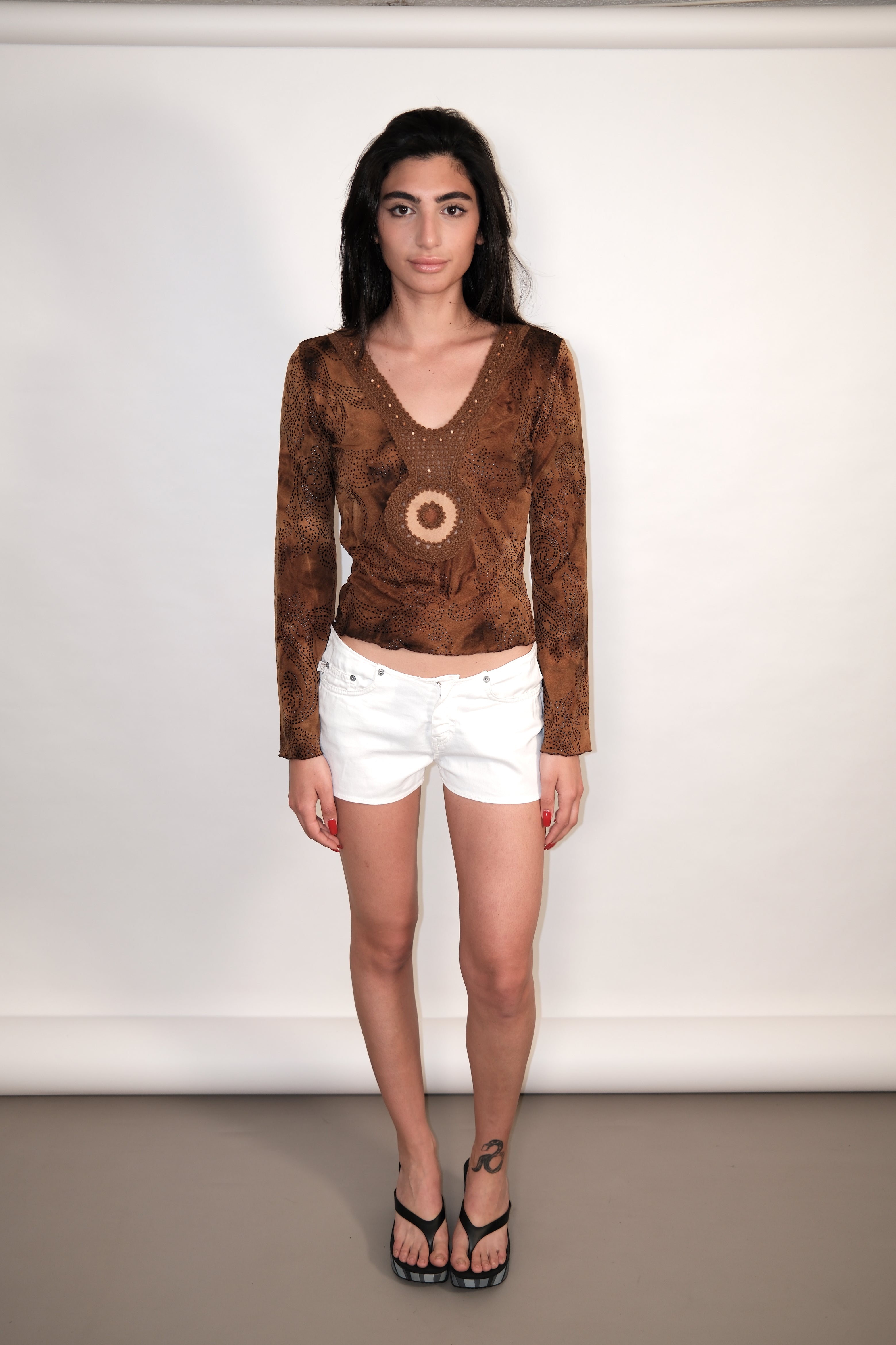 Long-Sleeve Crop Top with Crochet Detail and Decorative Elements