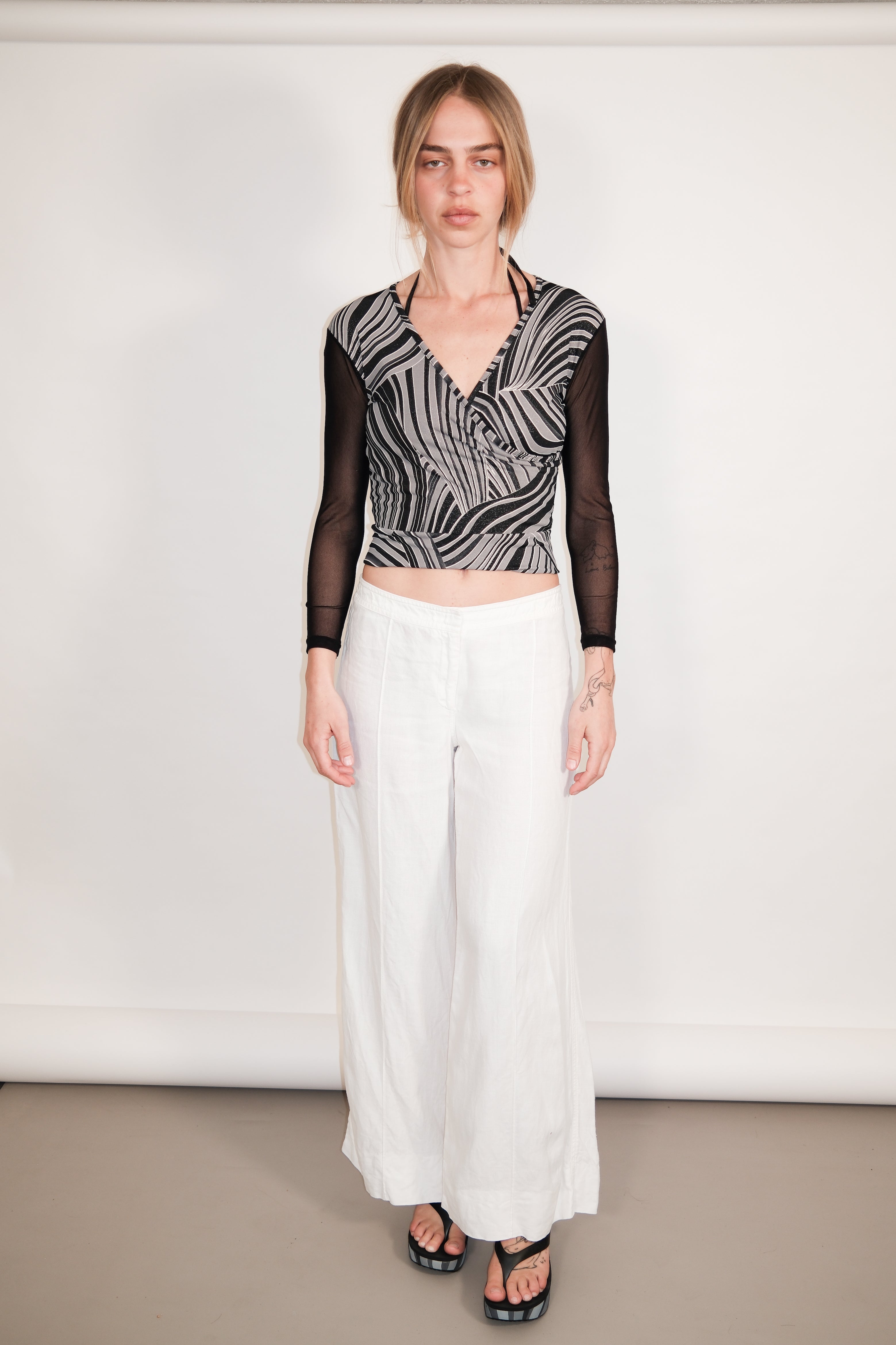 Black Wrap Top with Glitter Print and Sheer Back