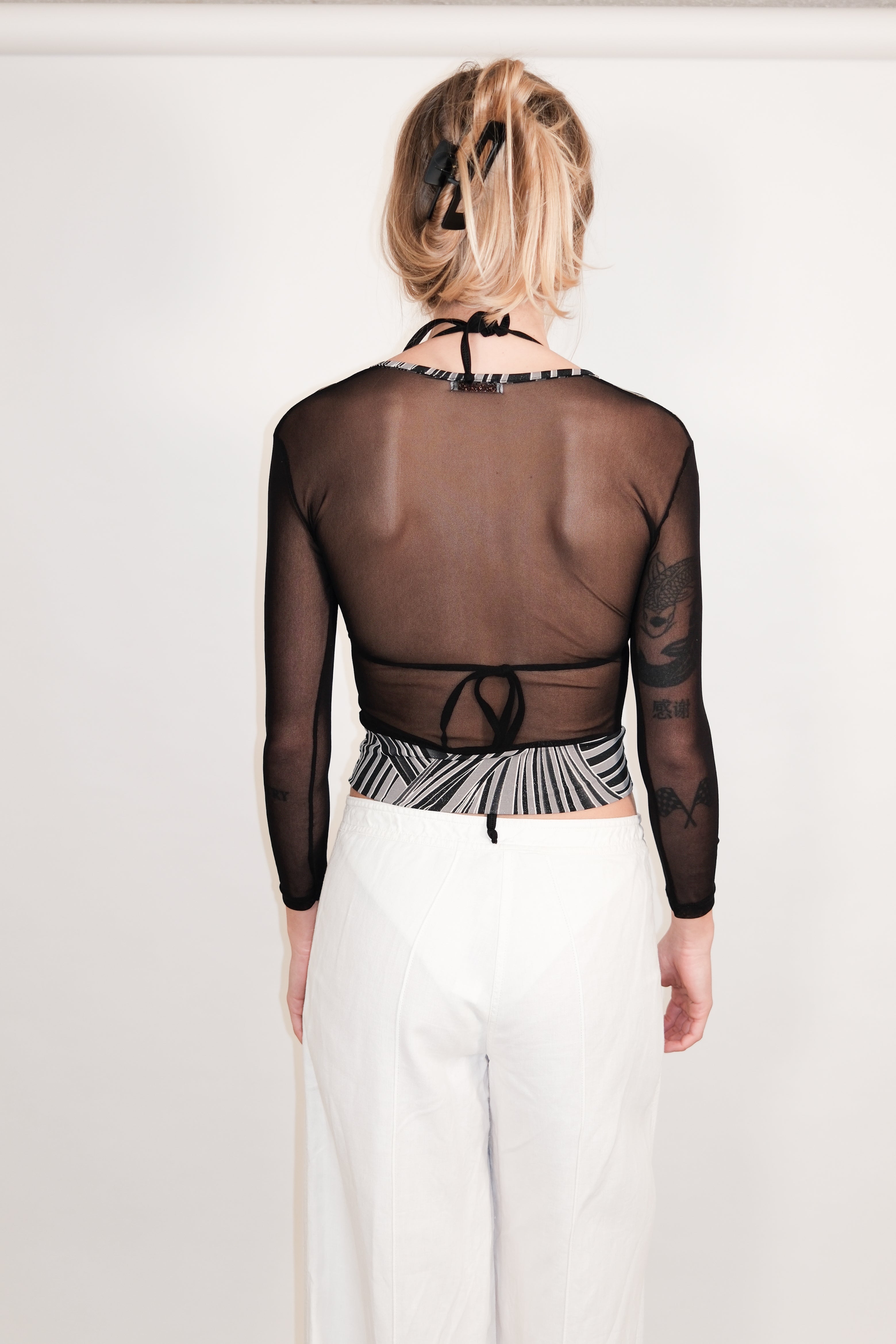 Black Wrap Top with Glitter Print and Sheer Back
