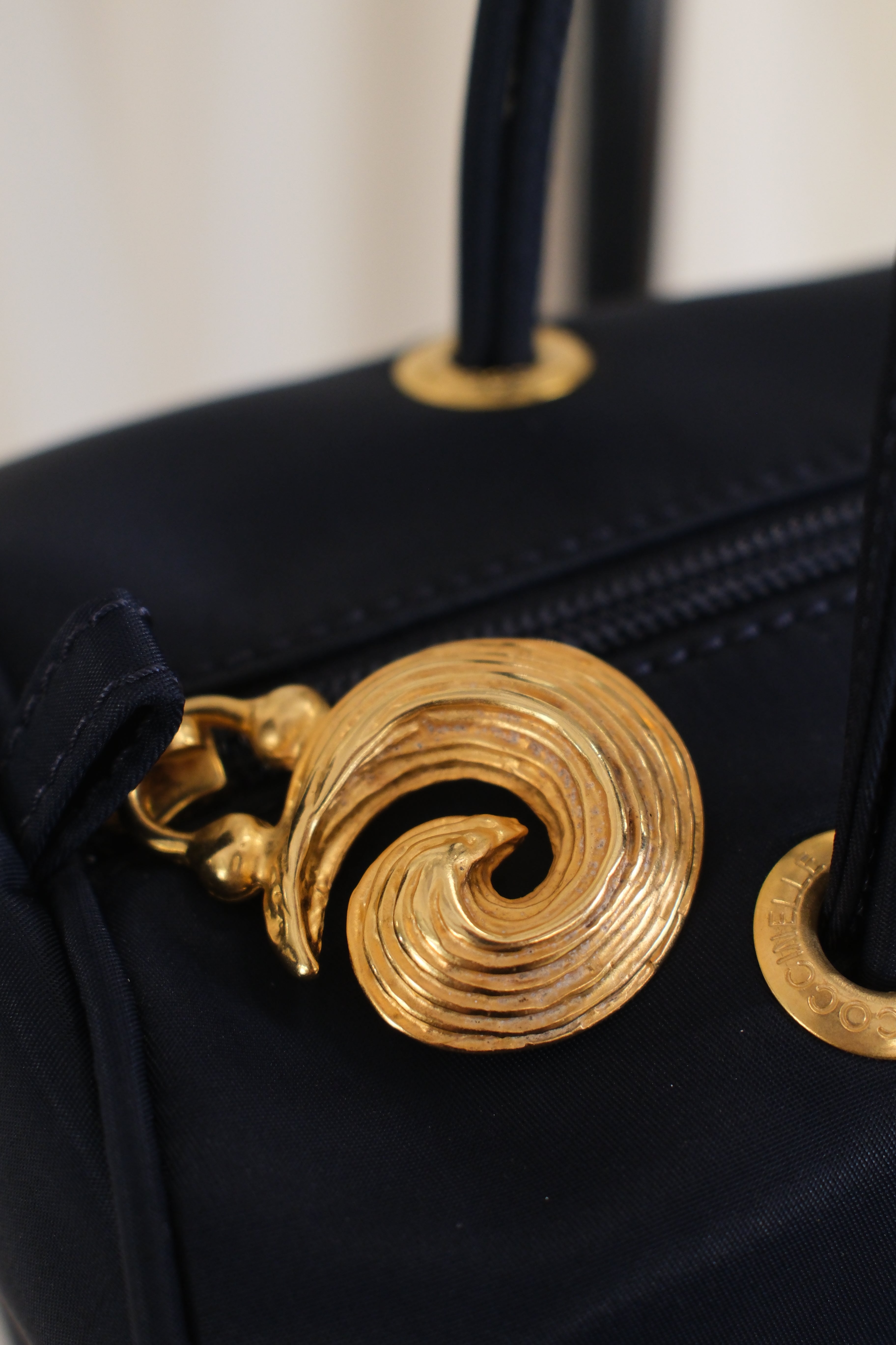 Coccinelle dark navy nylon Bag with Gold Metal Detailing