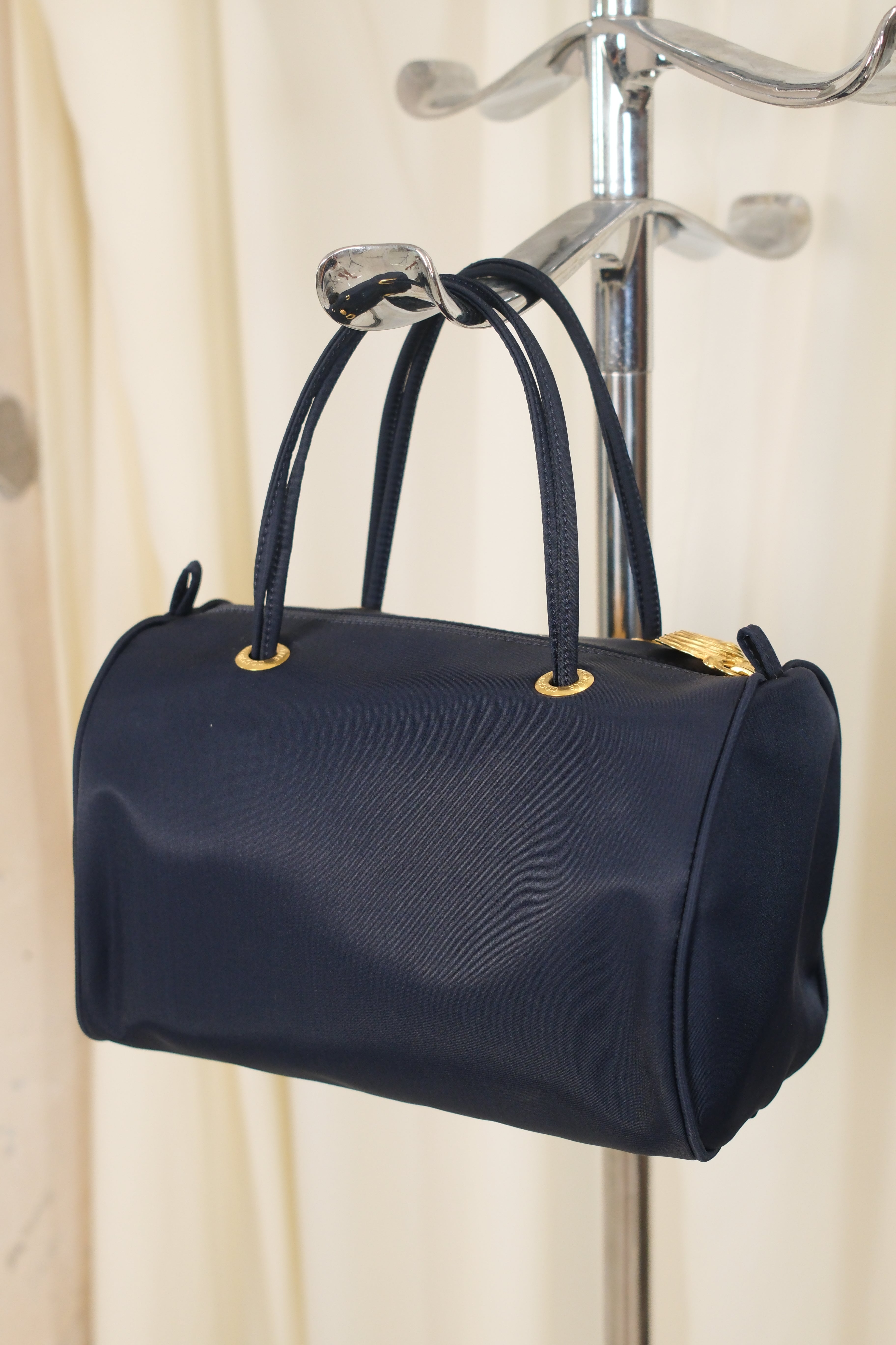 Coccinelle dark navy nylon Bag with Gold Metal Detailing