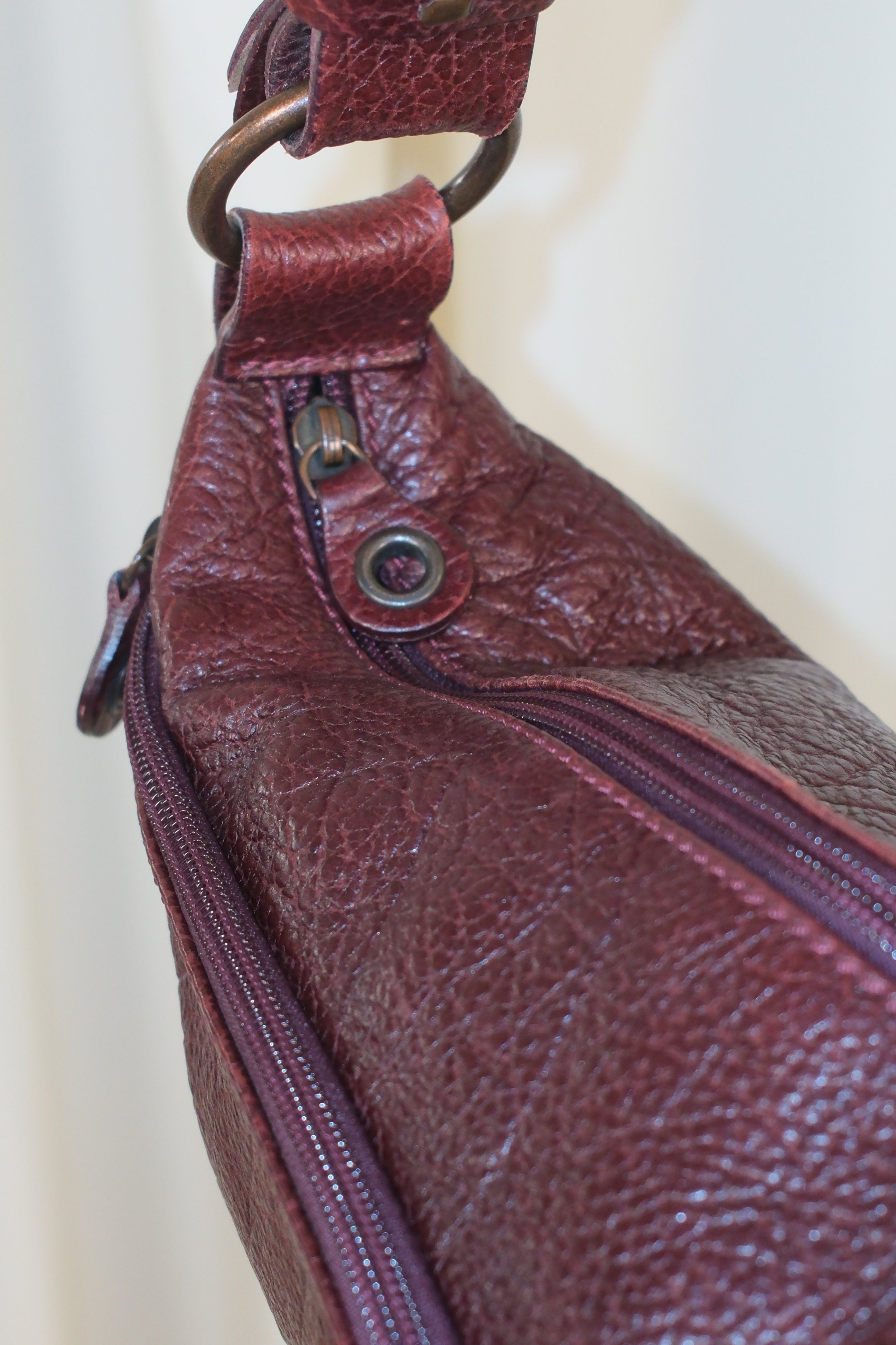 Francesco Biasia Asymmetrical Burgundy Bag with Multiple Pockets