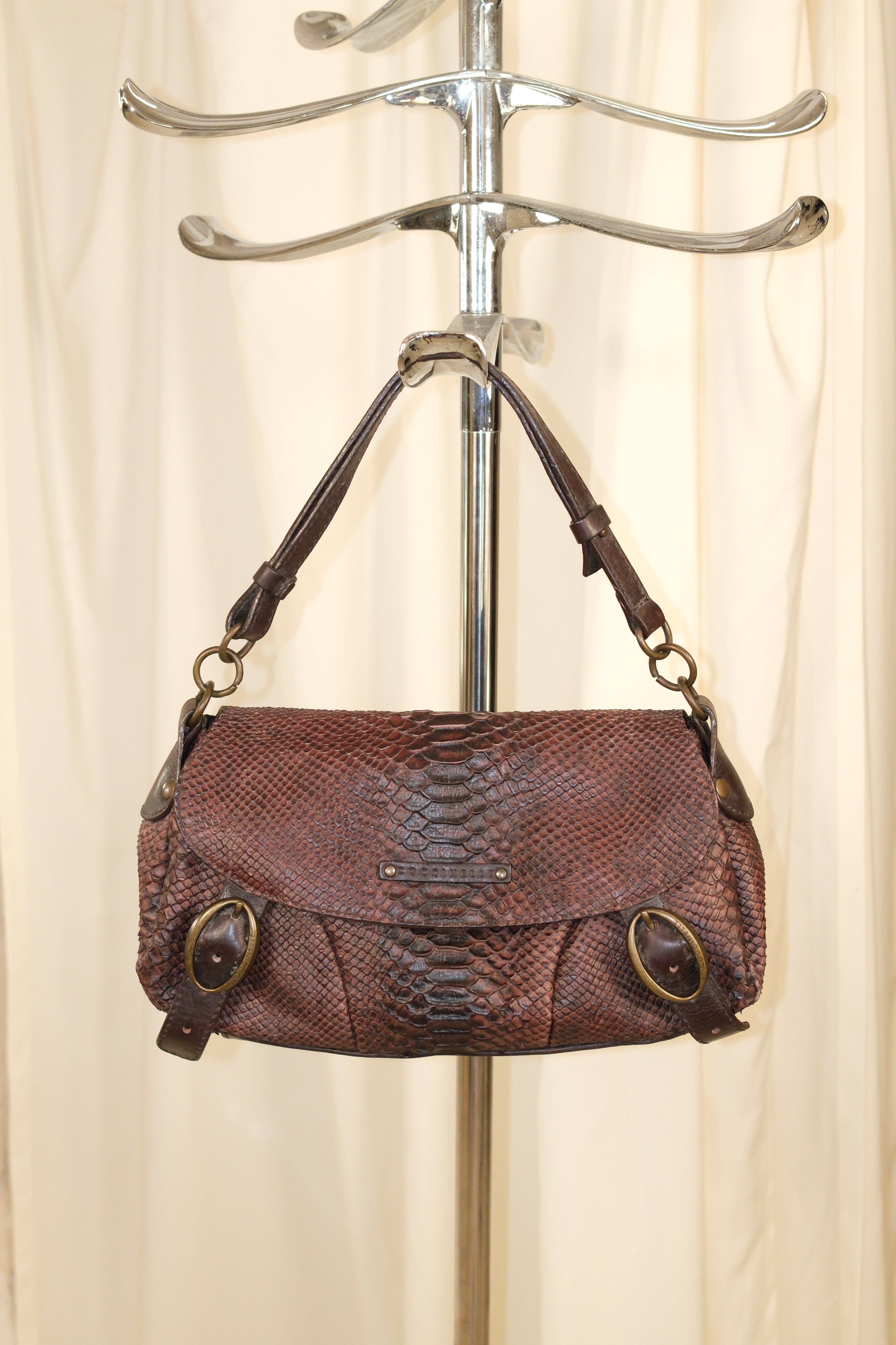 Coccinelle snake textured leather in mahogany color