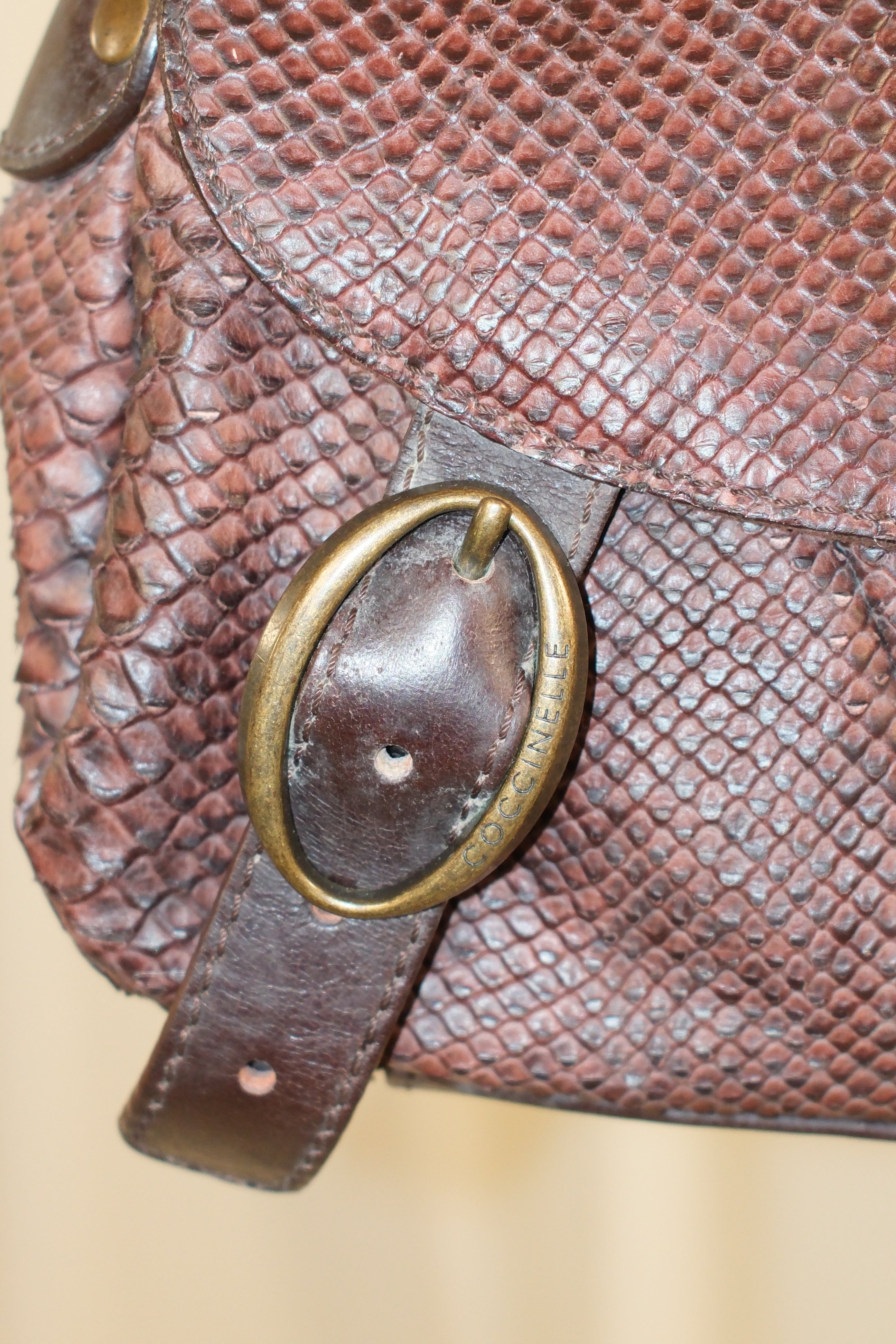 Coccinelle snake textured leather in mahogany color