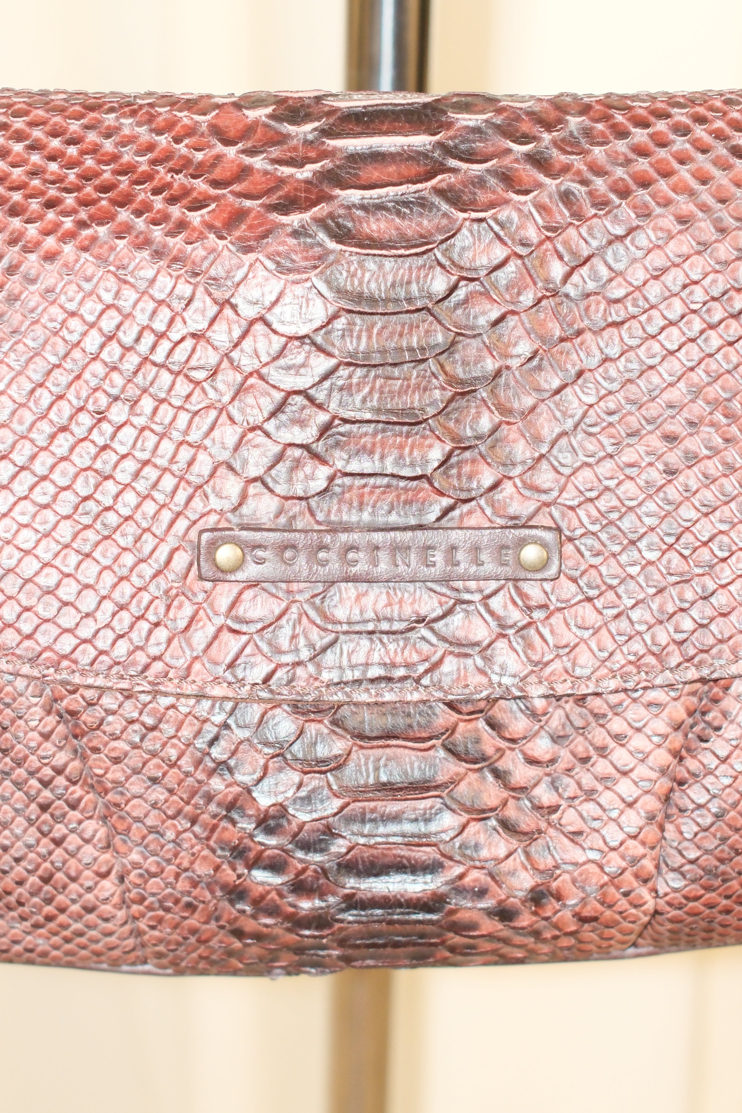 Coccinelle snake textured leather in mahogany color