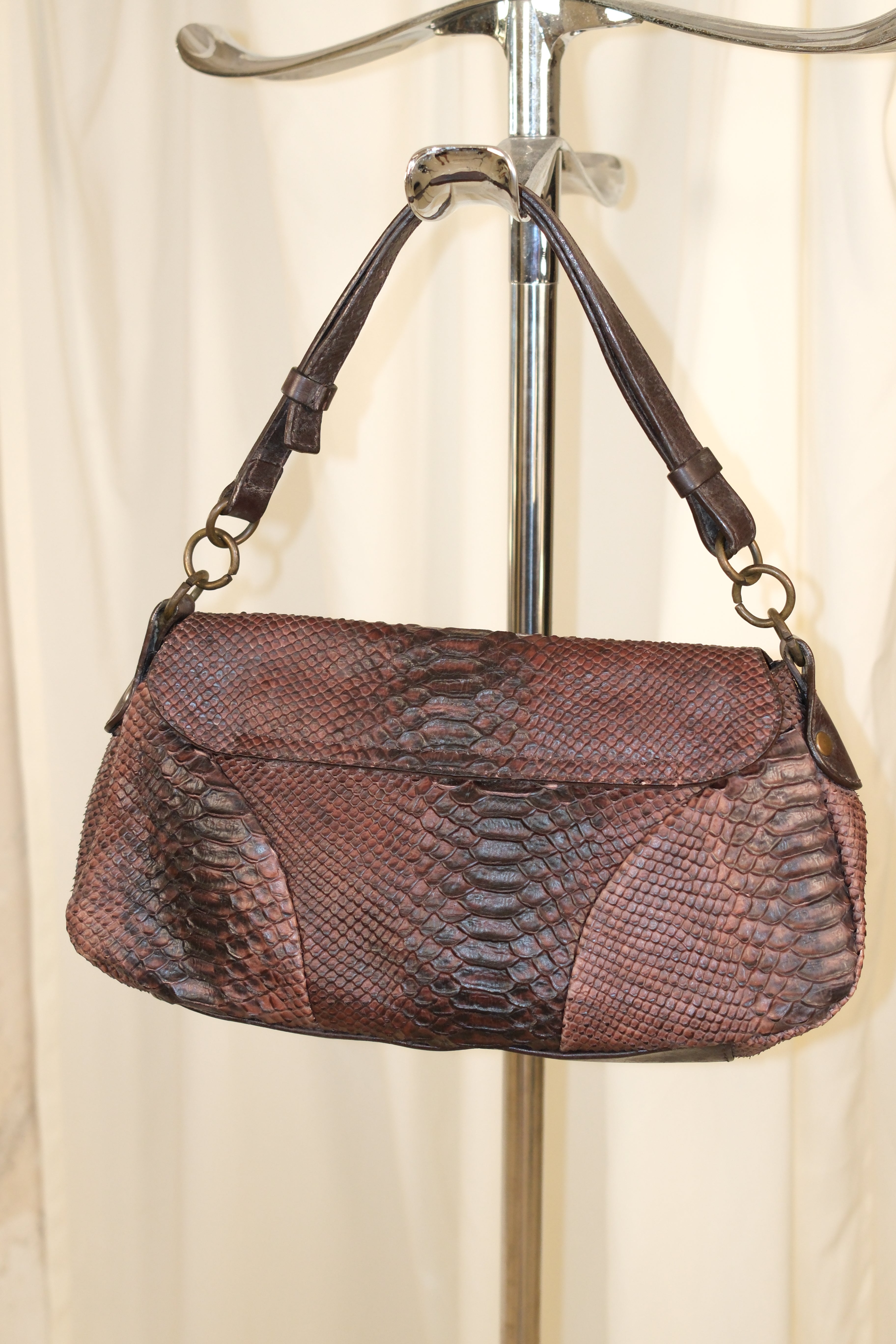 Coccinelle snake textured leather in mahogany color