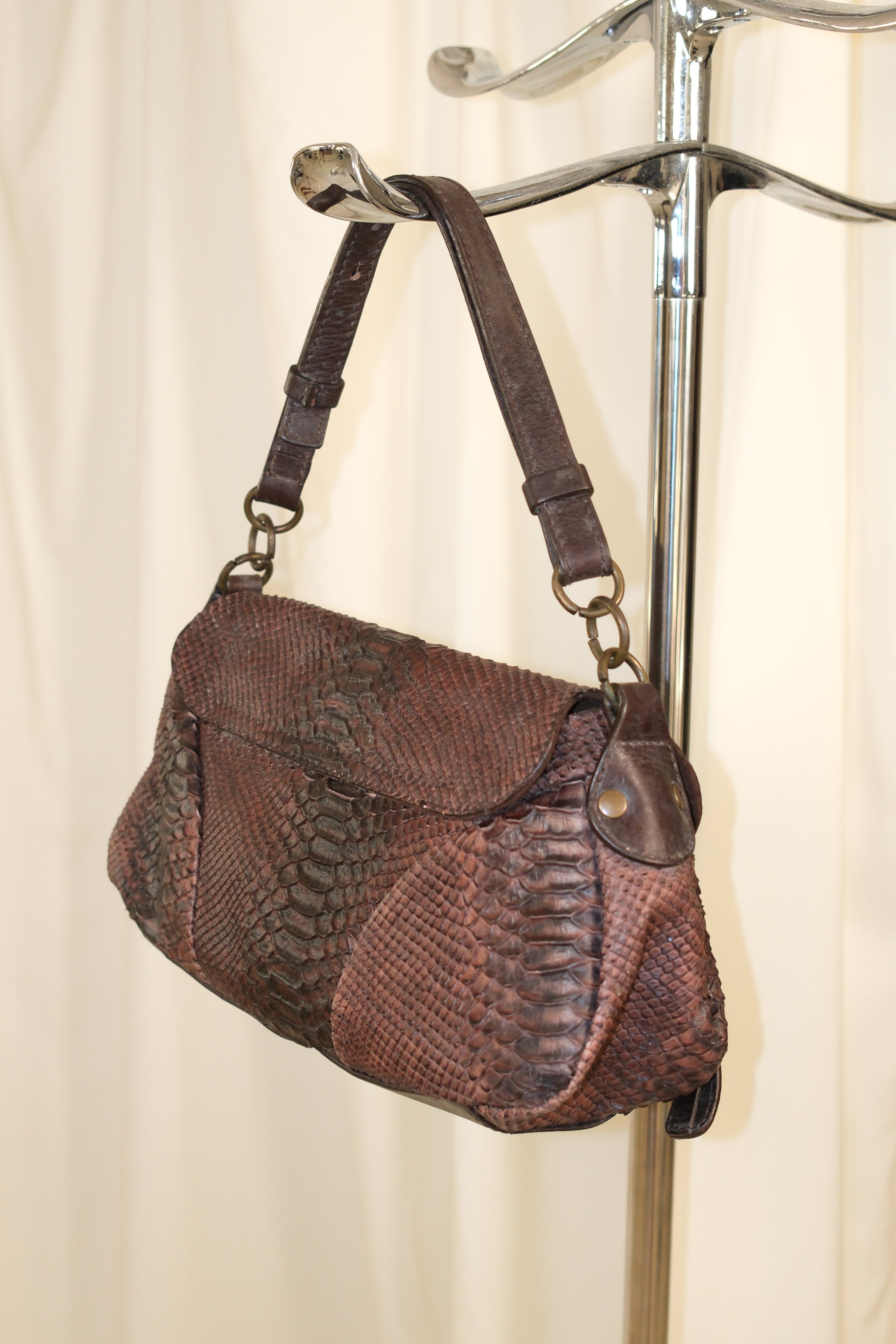Coccinelle snake textured leather in mahogany color
