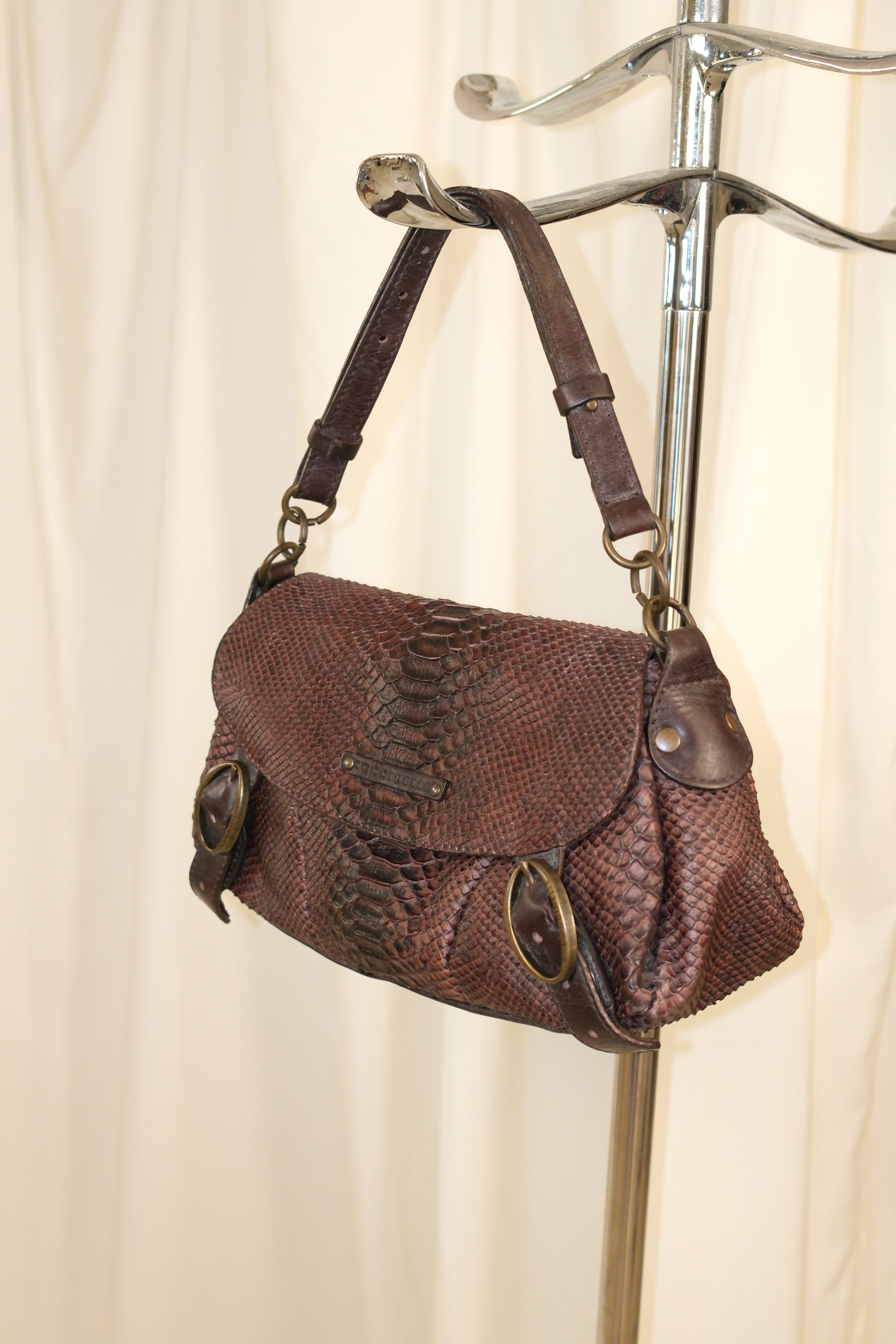 Coccinelle snake textured leather in mahogany color