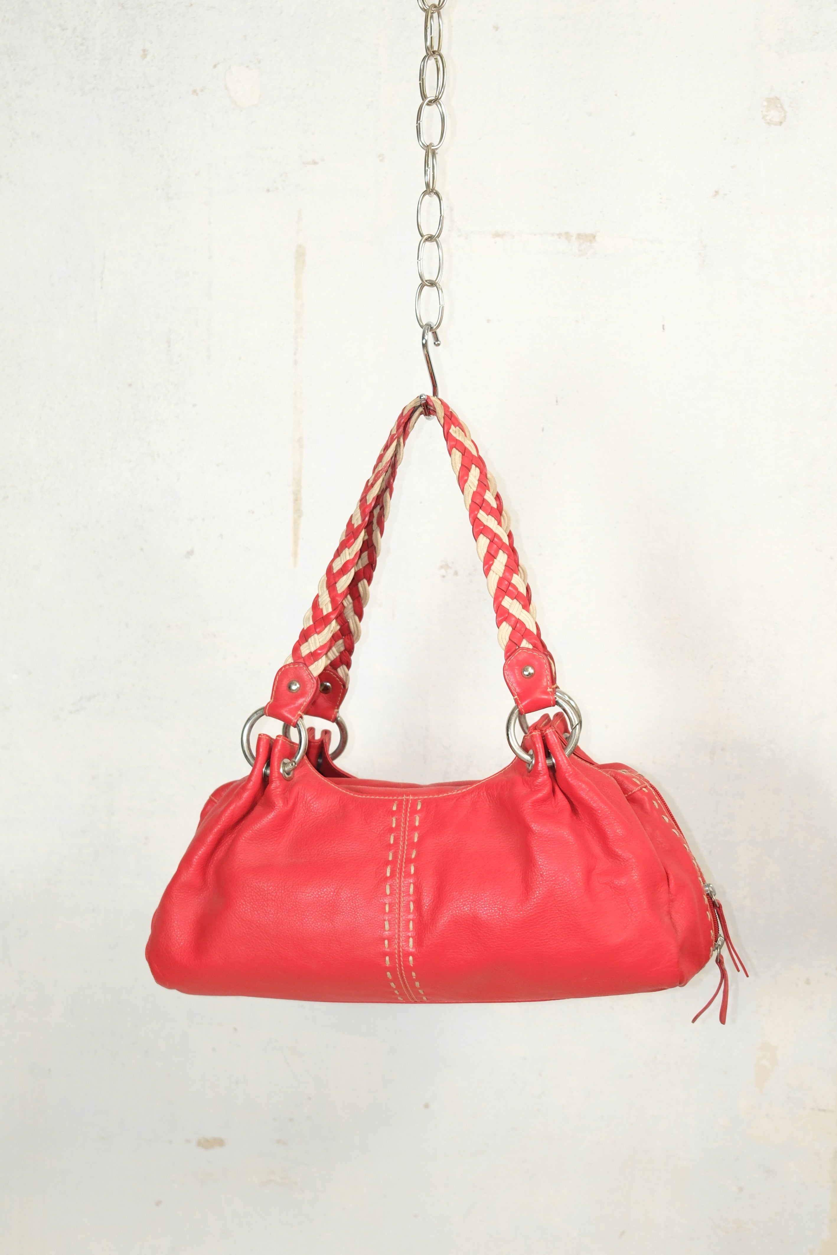 RED LEATHER BAG FEATURING WHITE STITCHING & BRAIDED HANDLES