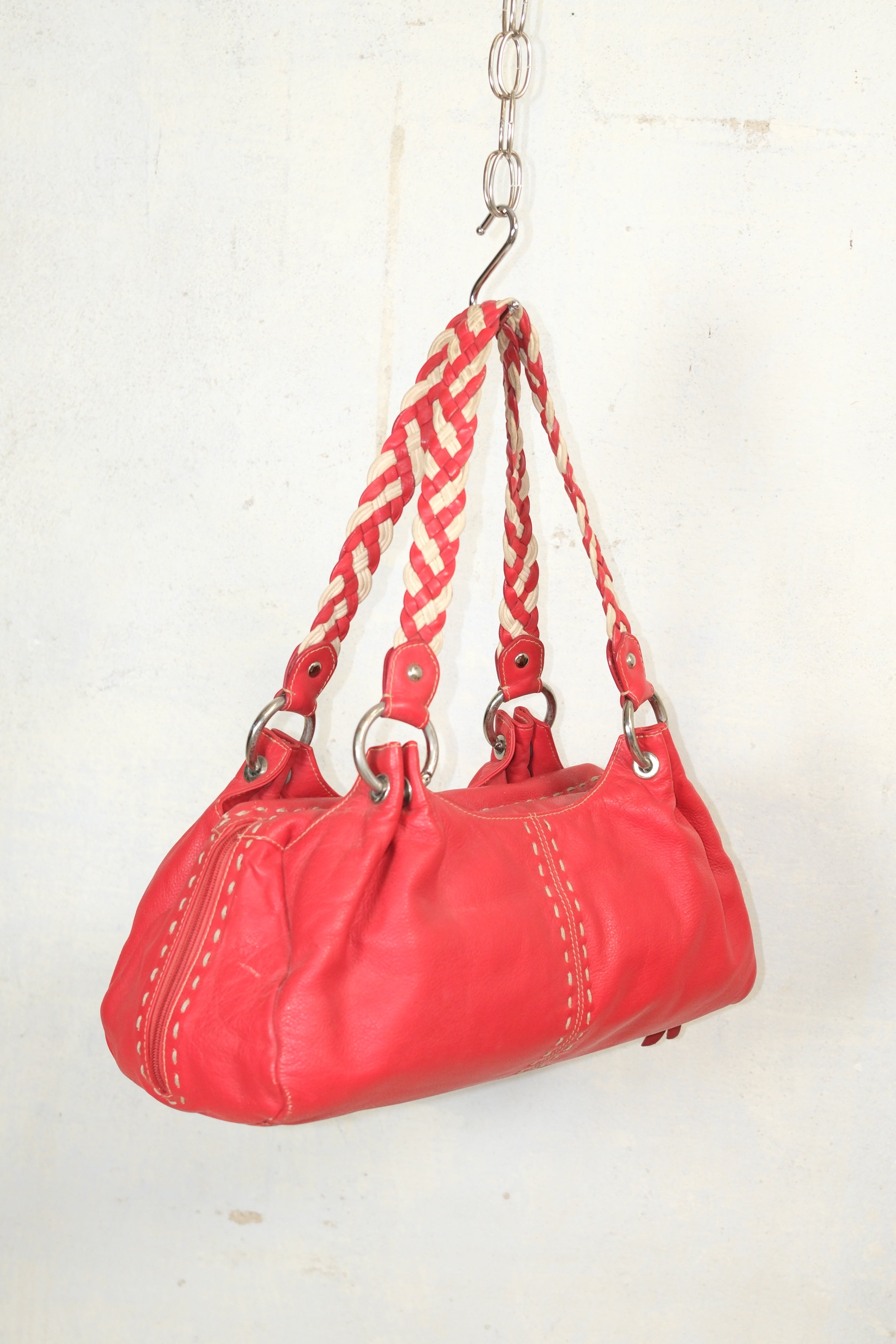 RED LEATHER BAG FEATURING WHITE STITCHING & BRAIDED HANDLES