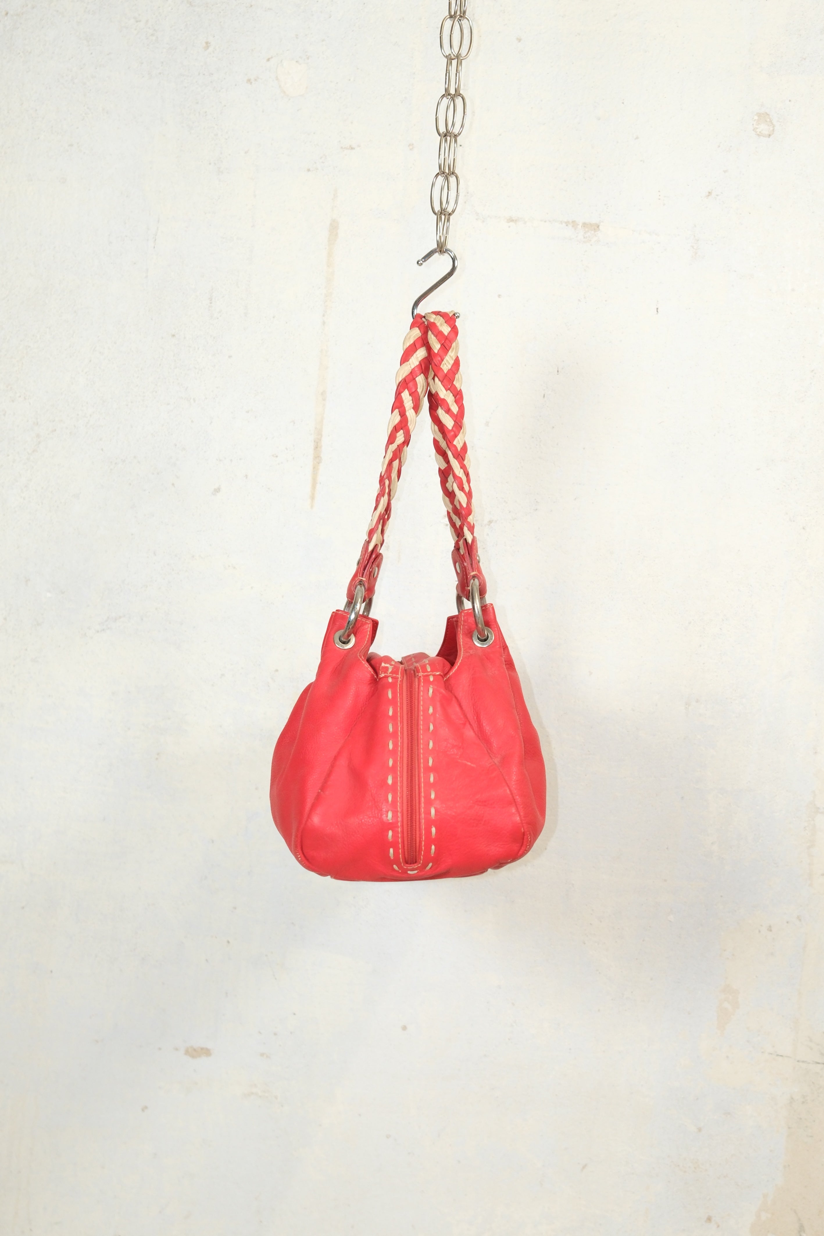 RED LEATHER BAG FEATURING WHITE STITCHING & BRAIDED HANDLES