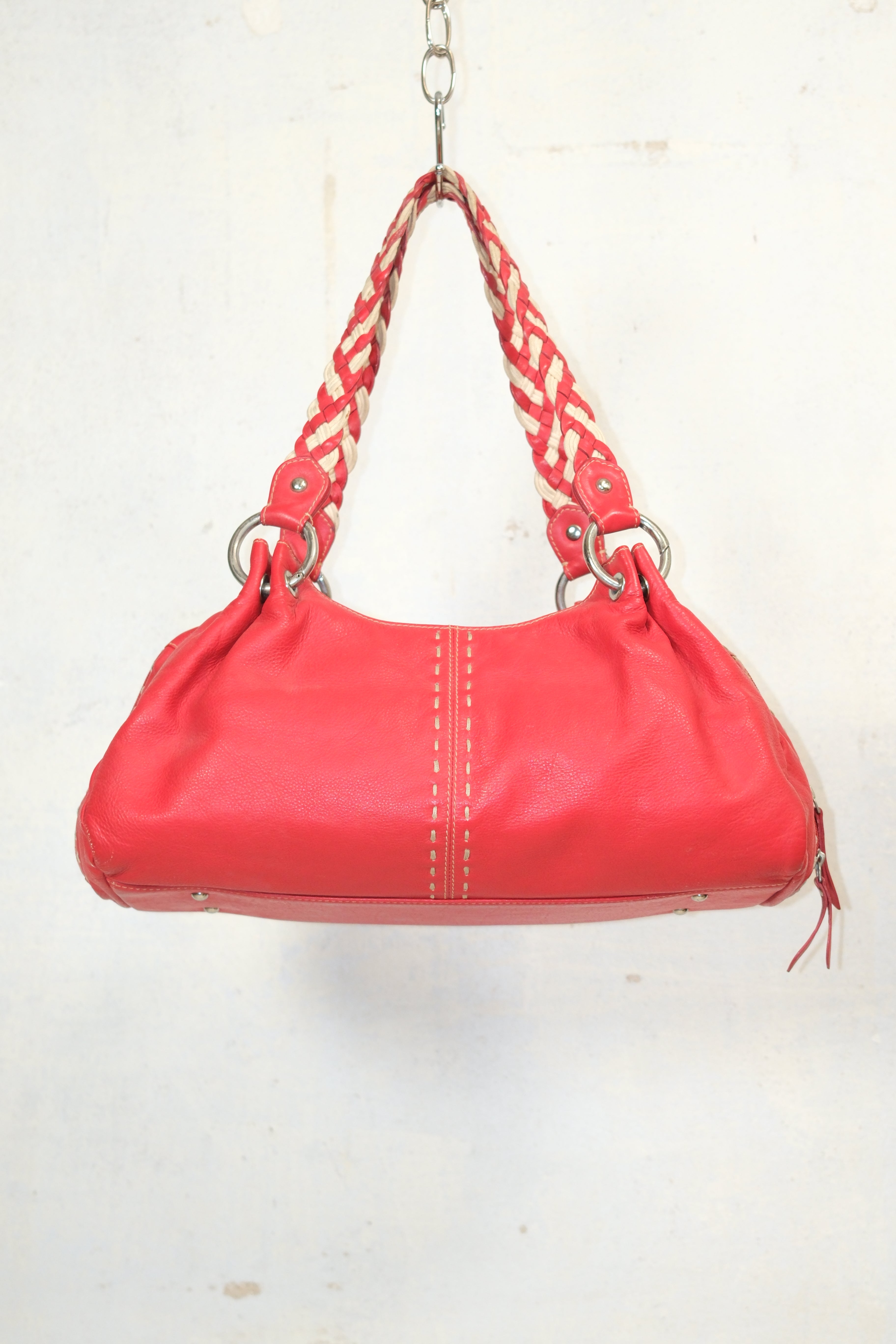 RED LEATHER BAG FEATURING WHITE STITCHING & BRAIDED HANDLES