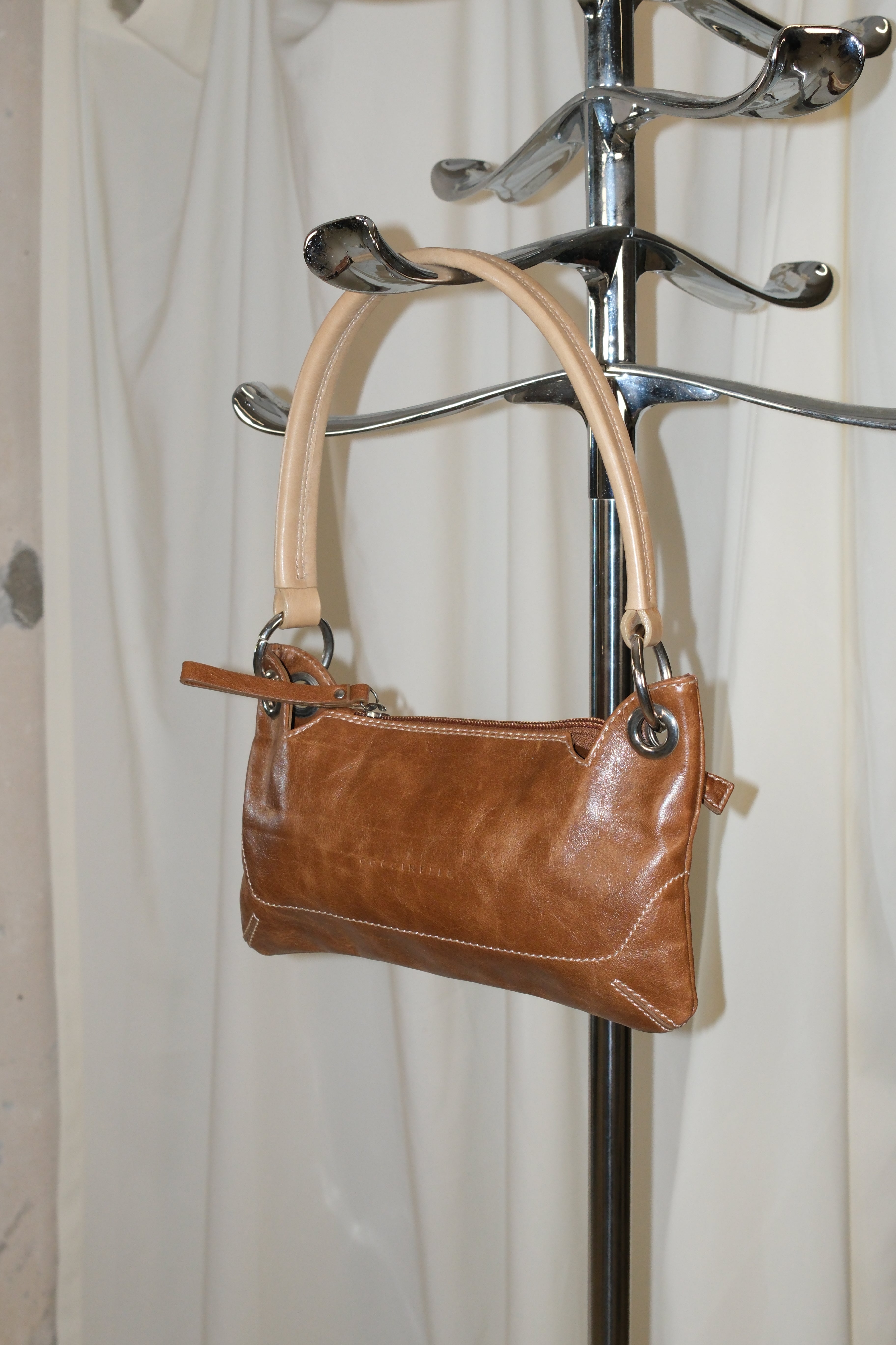 Coccinelle brown leather bag with cream stiff handle