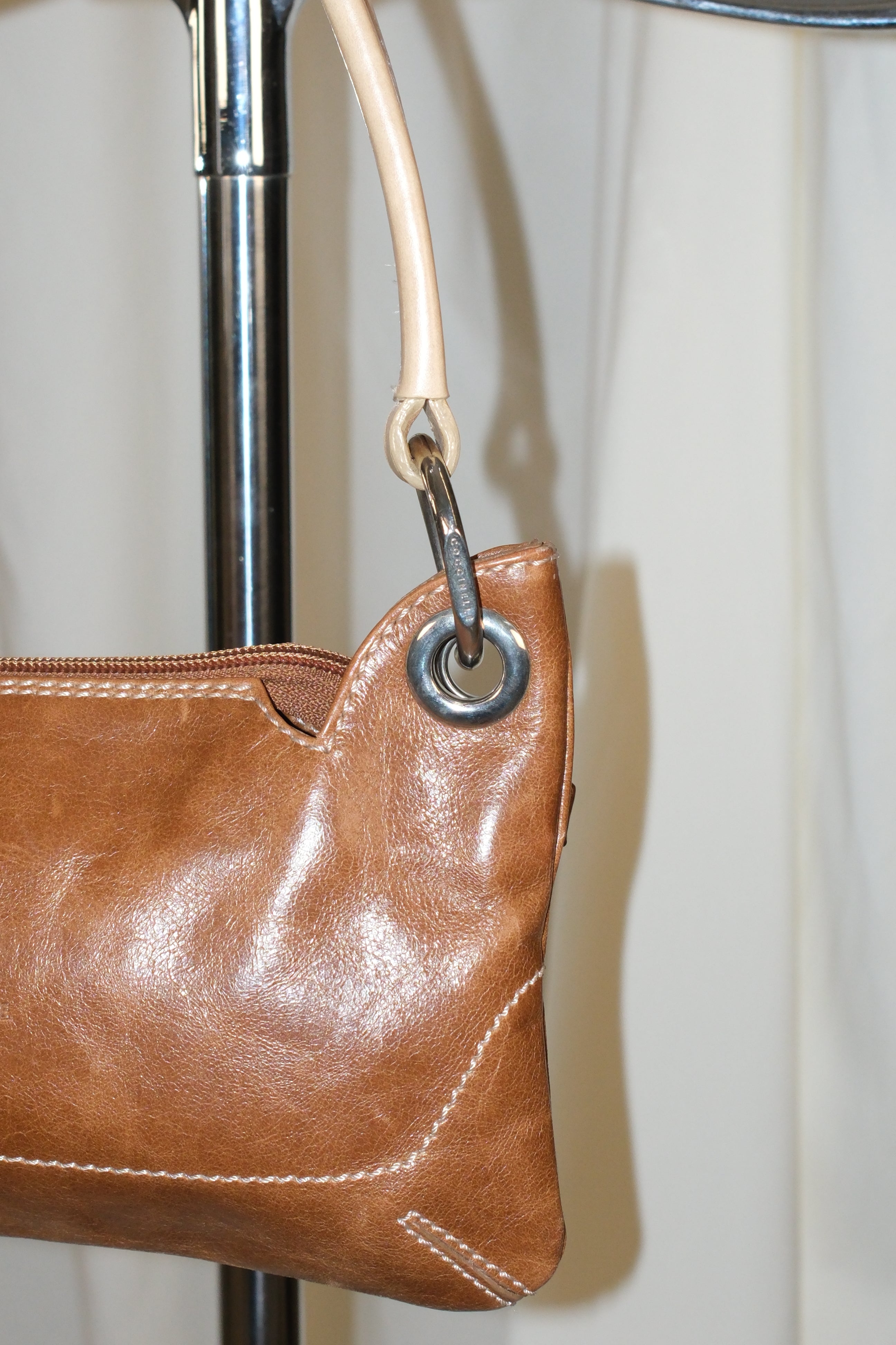 Coccinelle brown leather bag with cream stiff handle