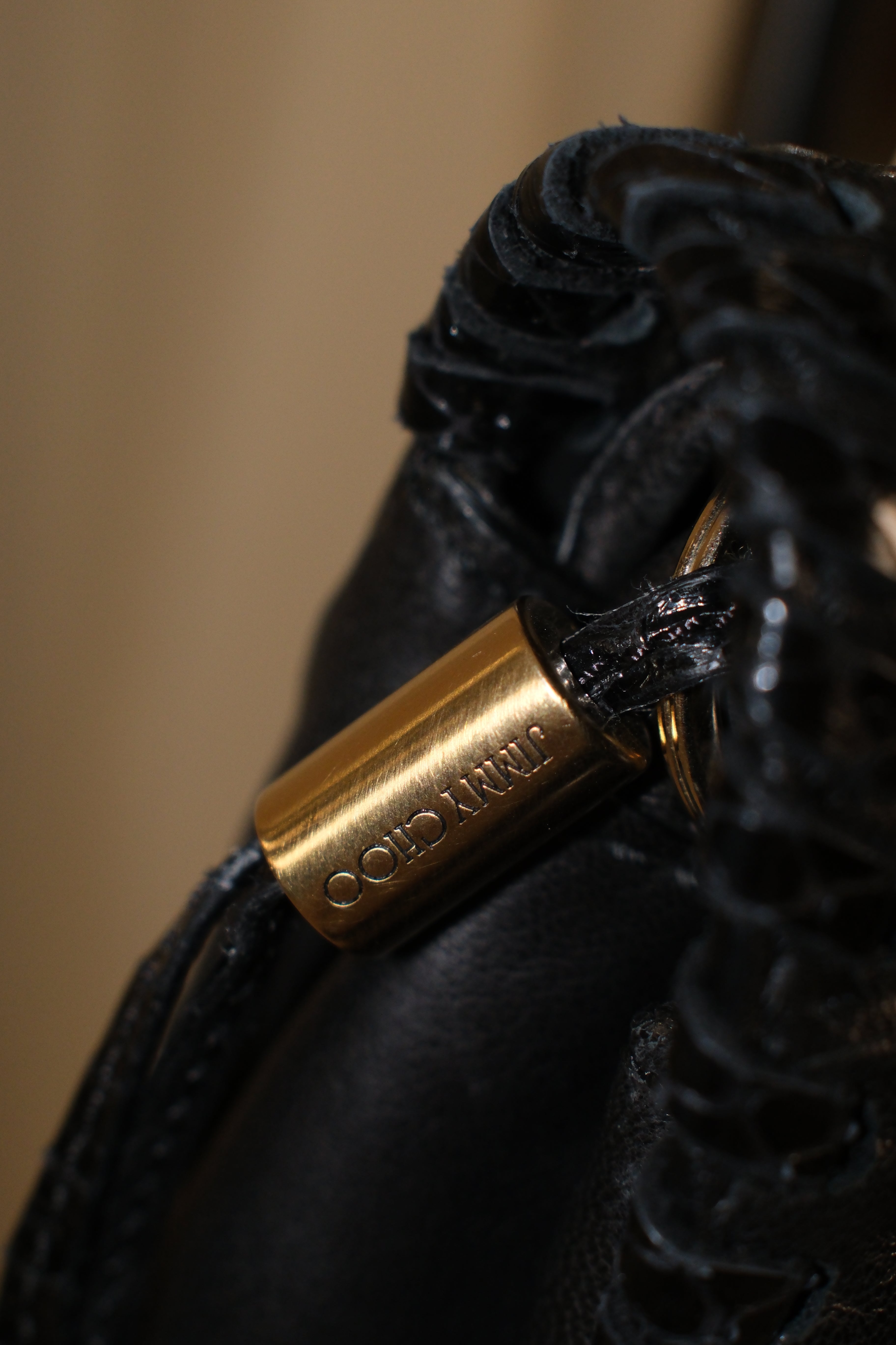 Jimmy Choo Black Leather Shoulder Bag with Textured Details and Gold Hardware