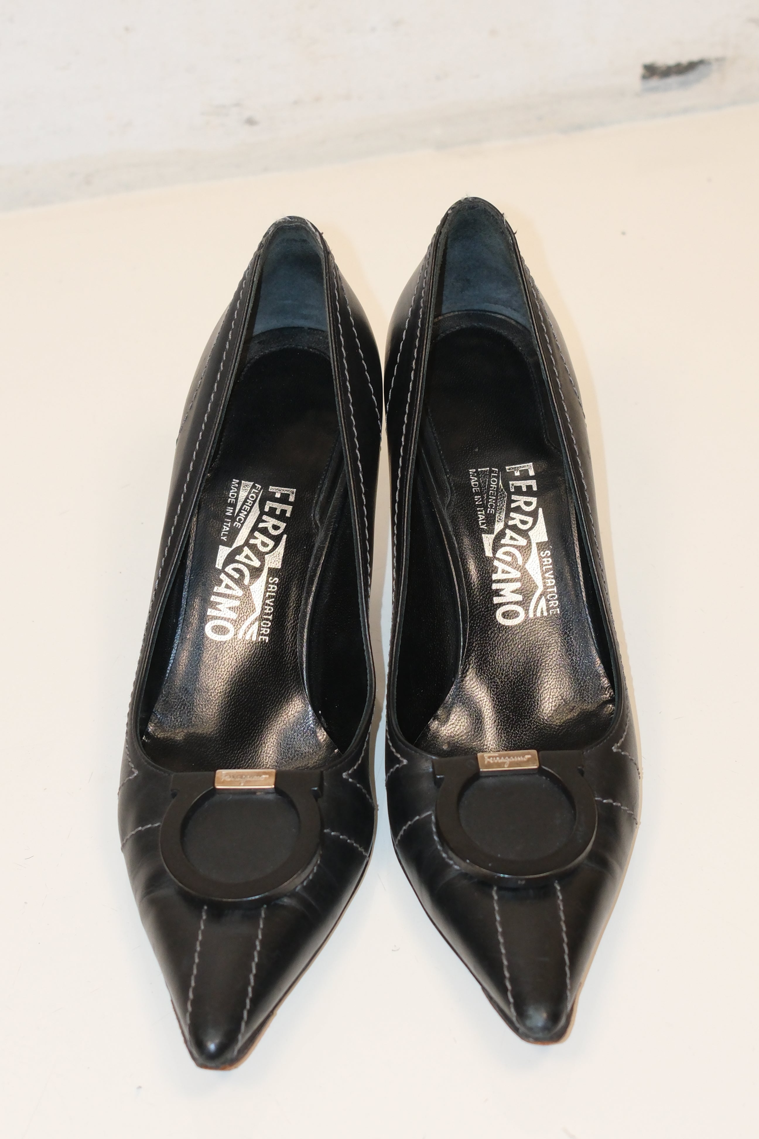 Ferragamo black pointed toe pumps with Gancini signature logo detail size 37