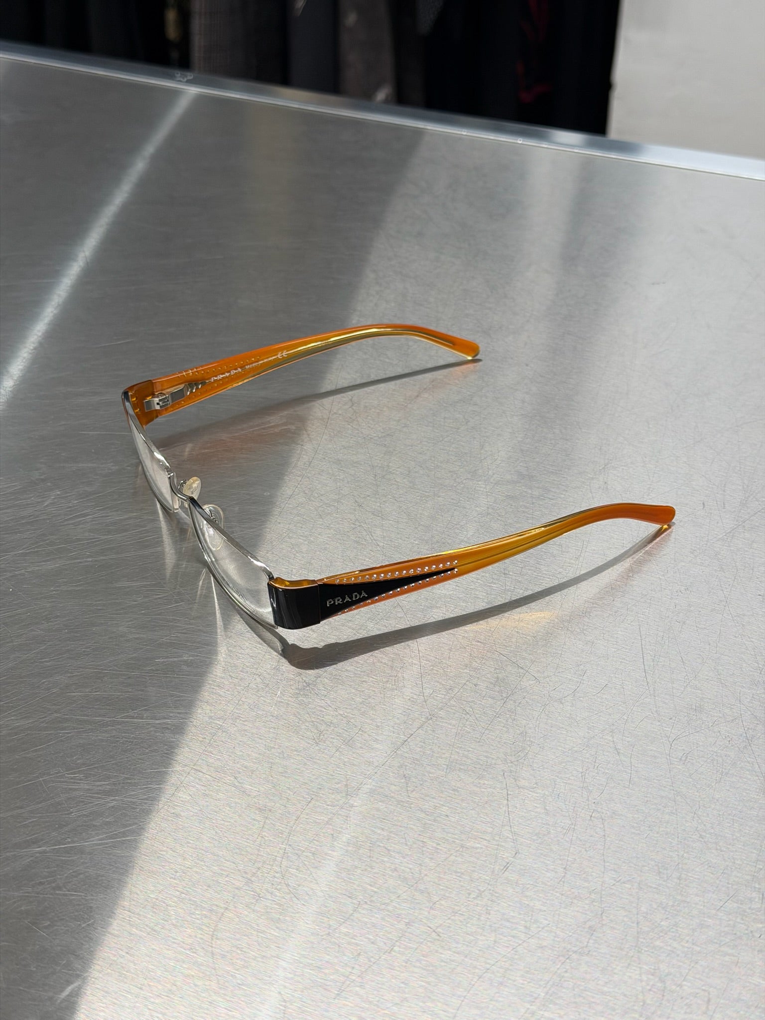 PRADA SILVER GLASSES WITH ORANGE AND BLACK TEMPLES AND RHINESTONES