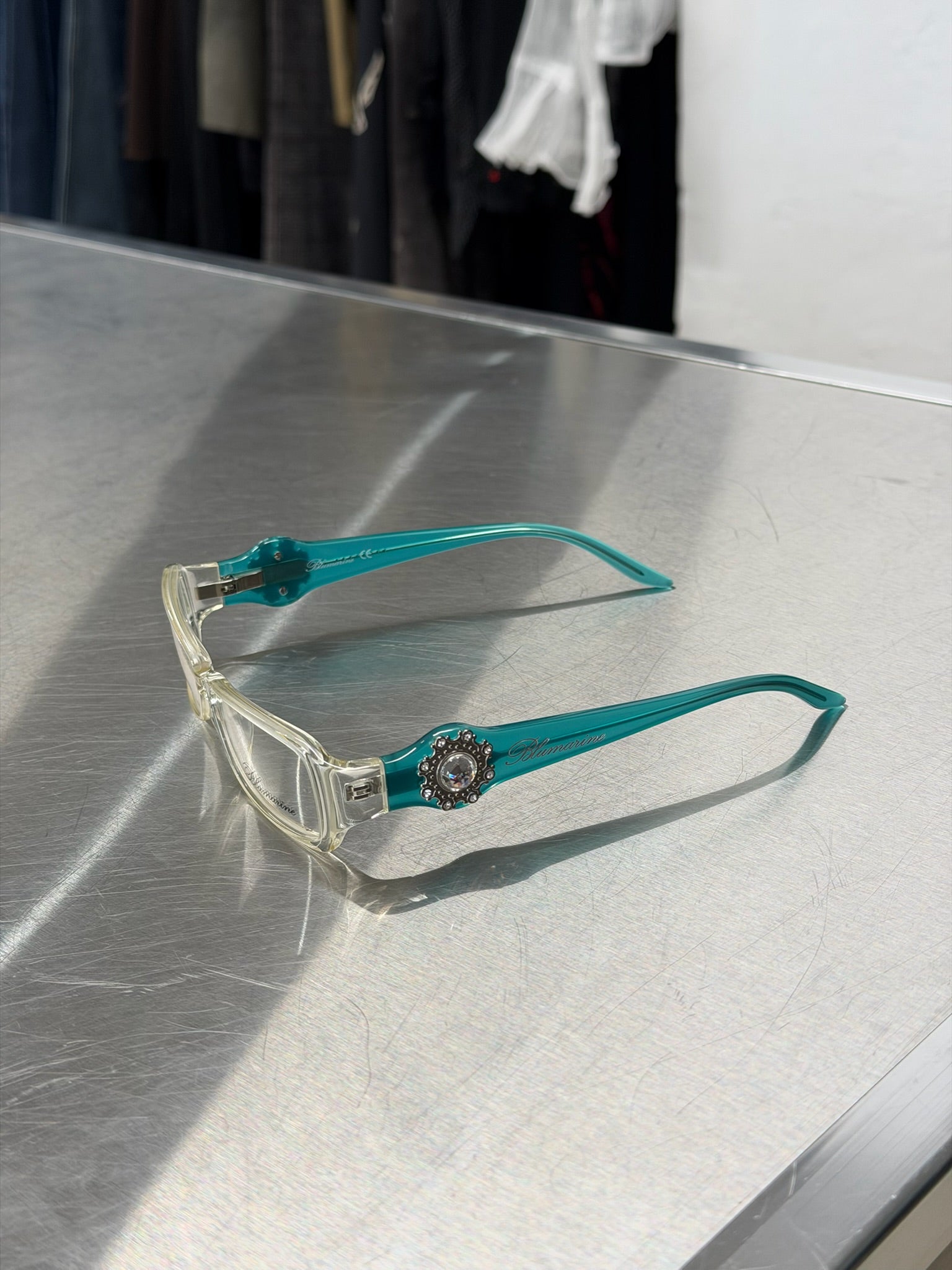 BLUMARINE TRANSPARENT GLASSES WITH AQUA TURQUOISE TEMPLES AND LARGE RHINESTONE DETAIL