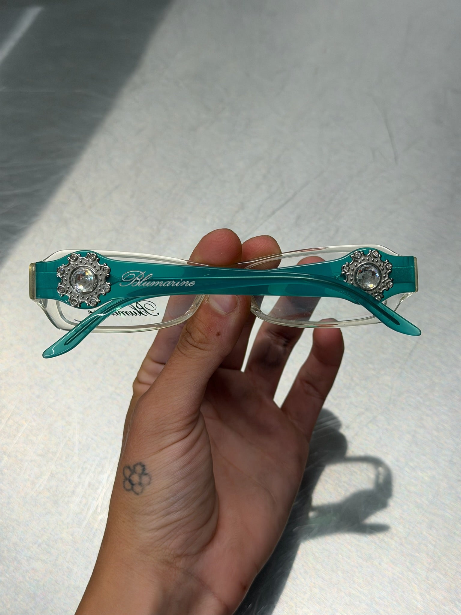 BLUMARINE TRANSPARENT GLASSES WITH AQUA TURQUOISE TEMPLES AND LARGE RHINESTONE DETAIL